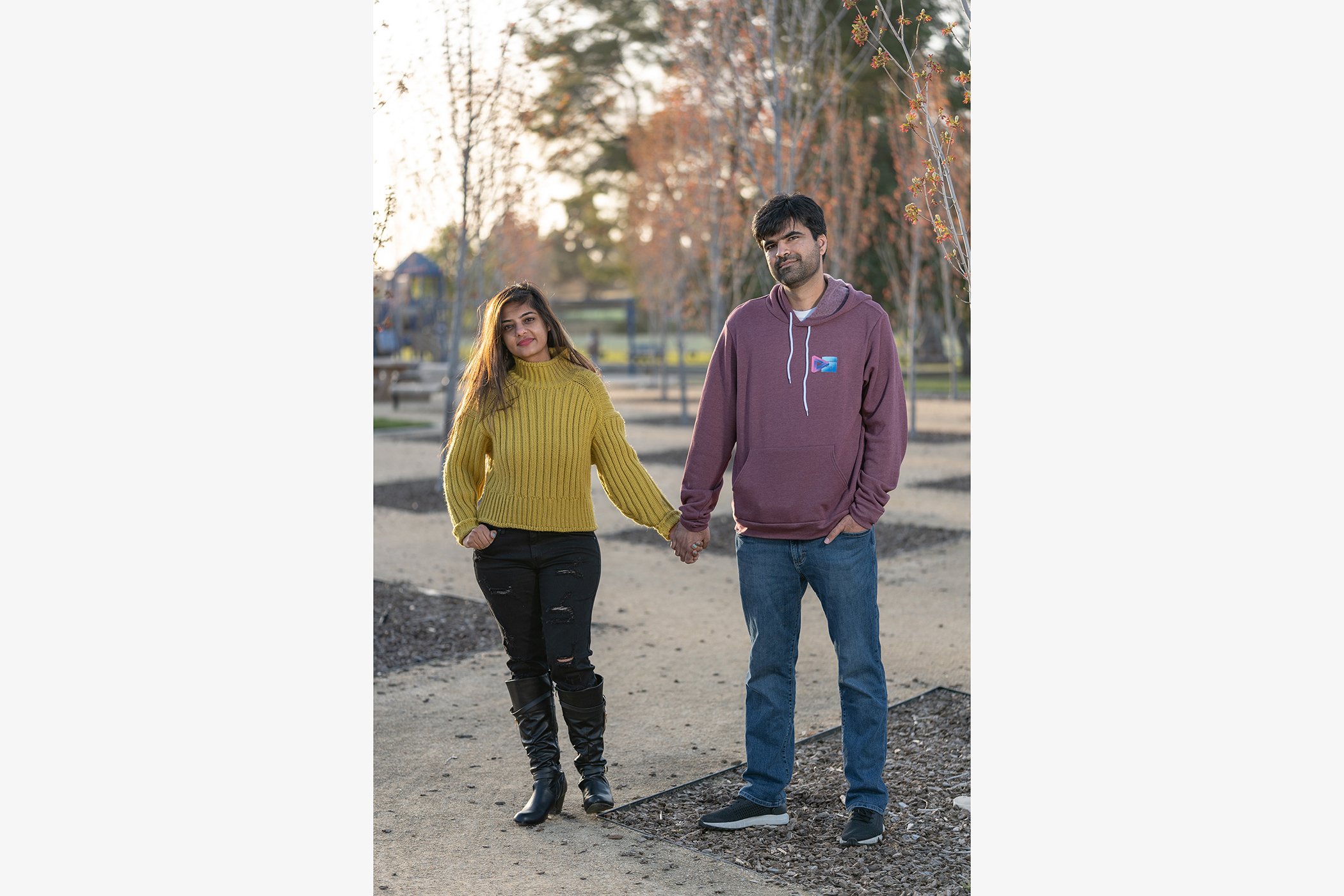 Abhishek and Pooja Daryani pose for a portrait at Lake Elizabeth in Fremont Calif., in April 2021.