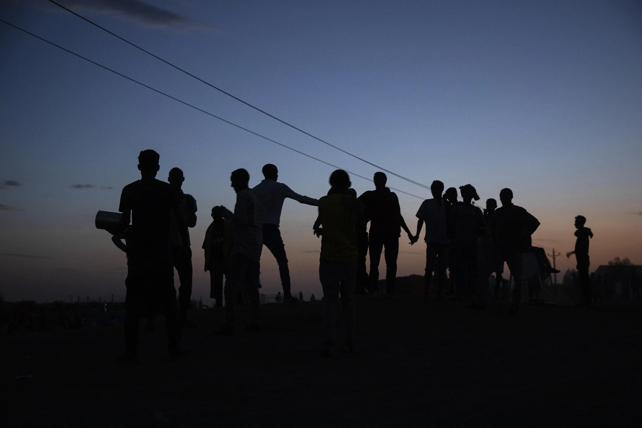 Tigrayan refugees gather in front of their shelters at Hamdeyat Transition Center near the Sudan-Ethiopia border, eastern Sudan, March 24, 2021.