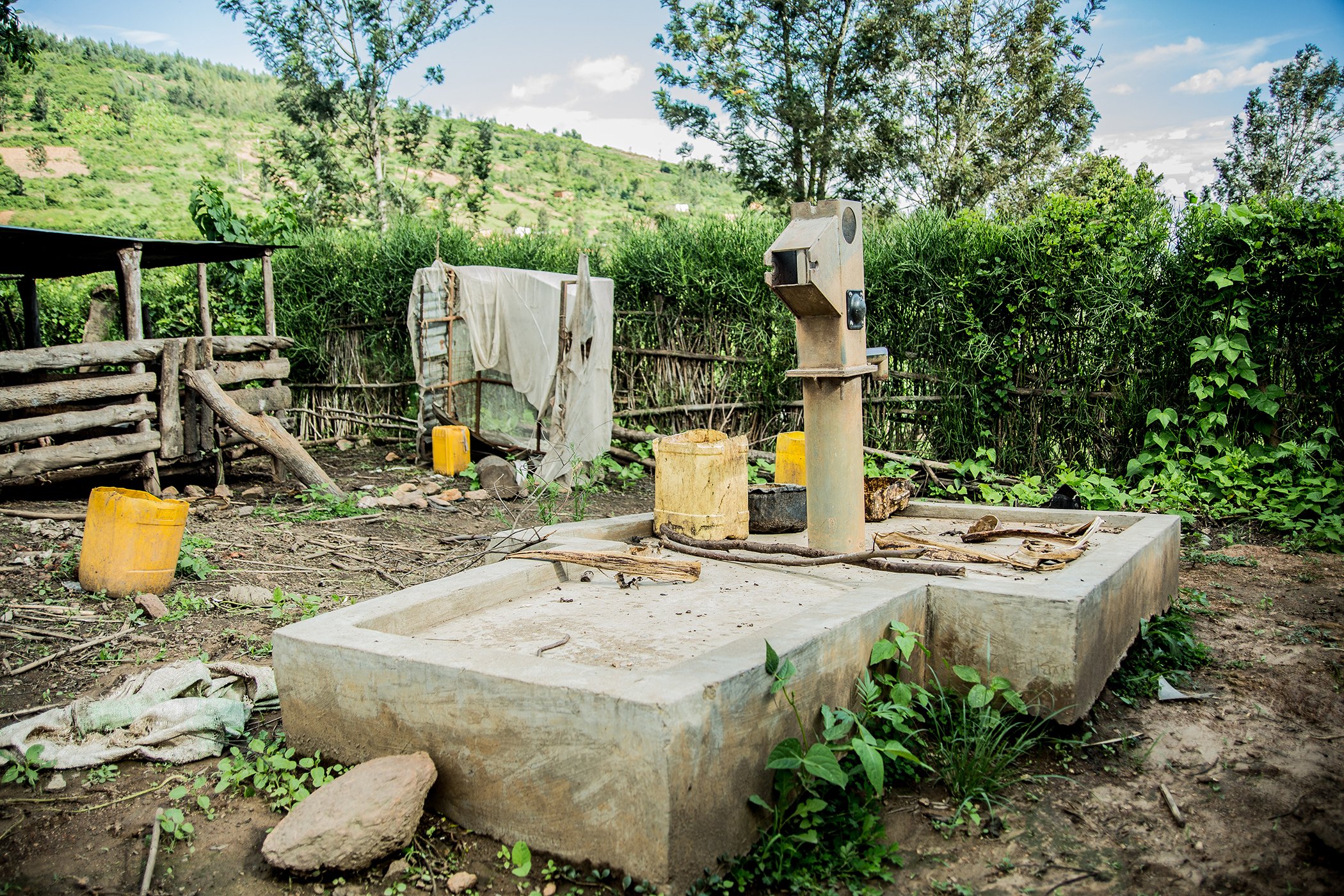 Pictured here is a broken hand pump, which Water Access Rwanda works to remove and replace with INUMA kiosks. Not only do the hand pumps break, but the water is not always safe and hard to pump. Each INUMA kiosk provides supplies piped, purified water.
