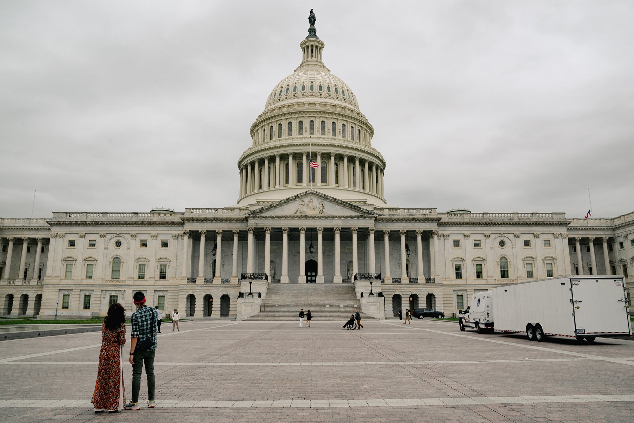 Seth Binder, Director of Advocacy at Project on Middle East Democracy, pushes Bahraini human rights activist Maryam Al-Khawaja in a wheelchair as they spend time on Capitol Hill ahead of meetings, in Washington, DC on May 5, 2022.