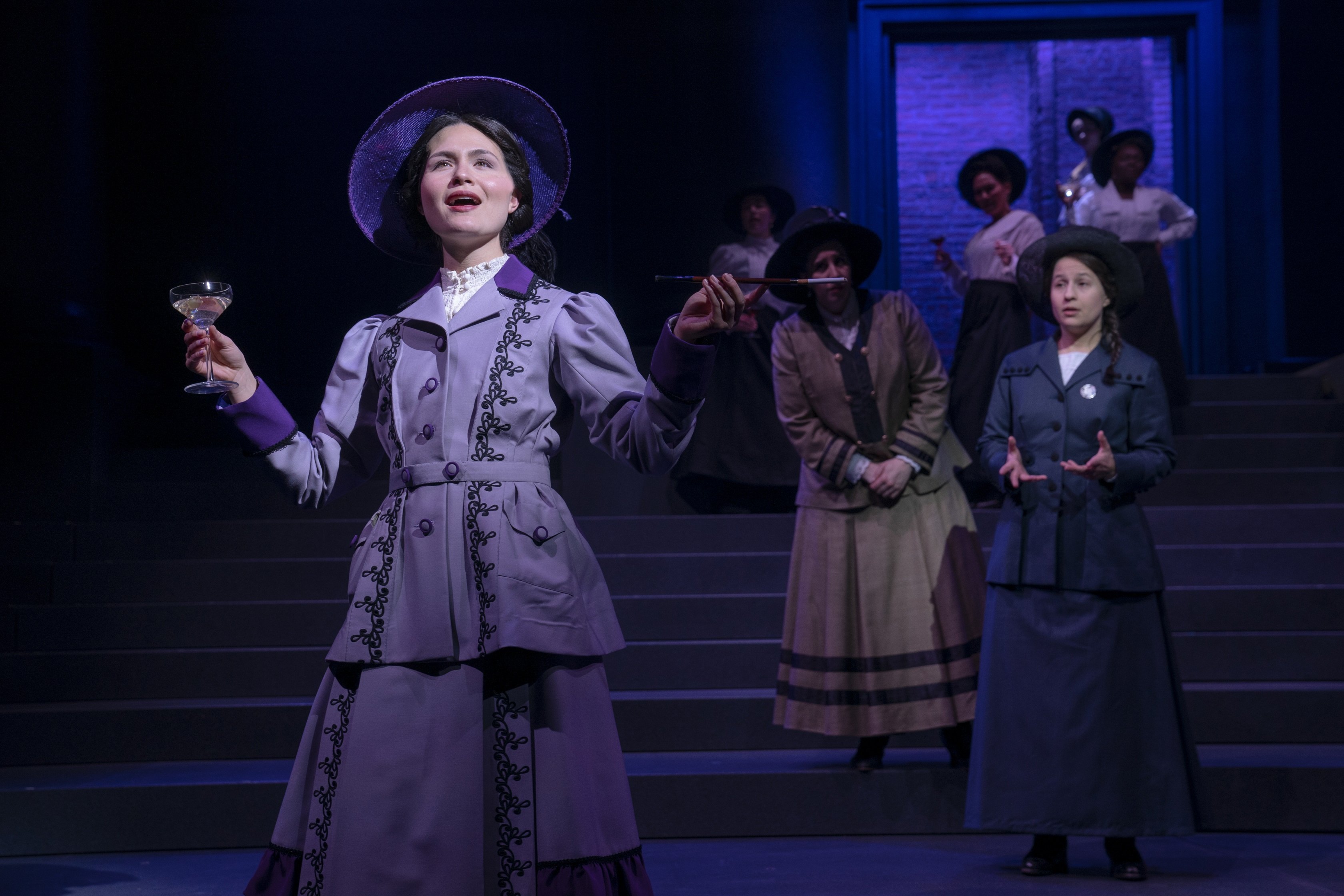 Phillipa Soo (foreground) in the world premiere of musical "Suffs," with book, music, and lyrics by Shaina Taub, music direction and music supervision by Andrea Grody, choreography by Raja Feather Kelly, and direction by Leigh Silverman. Phillipa Soo (foreground) in the world premiere of musical "Suffs," with book, music, and lyrics by Shaina Taub, music direction and music supervision by Andrea Grody, choreography by Raja Feather Kelly, and direction by Leigh Silverman.