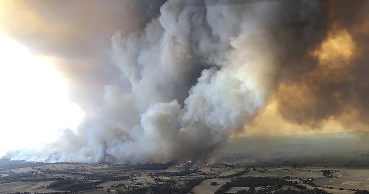 Wildfires rage under plumes of smoke in Bairnsdale, Australia on Dec. 30, 2019.