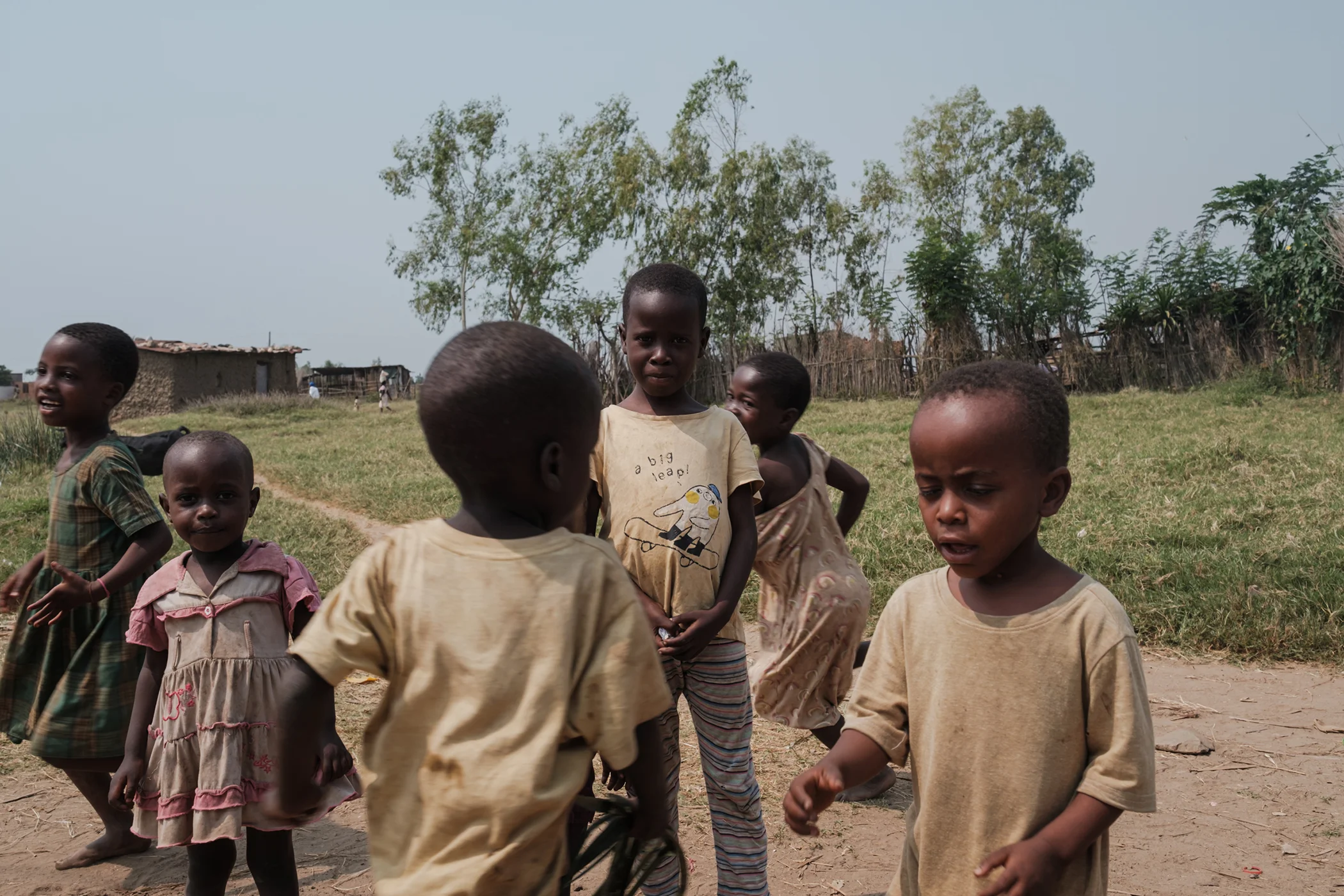 Kaneza Ndayisaba stands surrounded by other children outside her home in Gaharawe village in Burundi in July 2025. Since contracting poliovirus due to missing routine immunizations, Kaneza experienced partial paralysis in her legs and one arm. Kaneza Ndayisaba stands surrounded by other children outside her home in Gaharawe village in Burundi in July 2025. Since contracting poliovirus due to missing routine immunizations, Kaneza experienced partial paralysis in her legs and one arm.