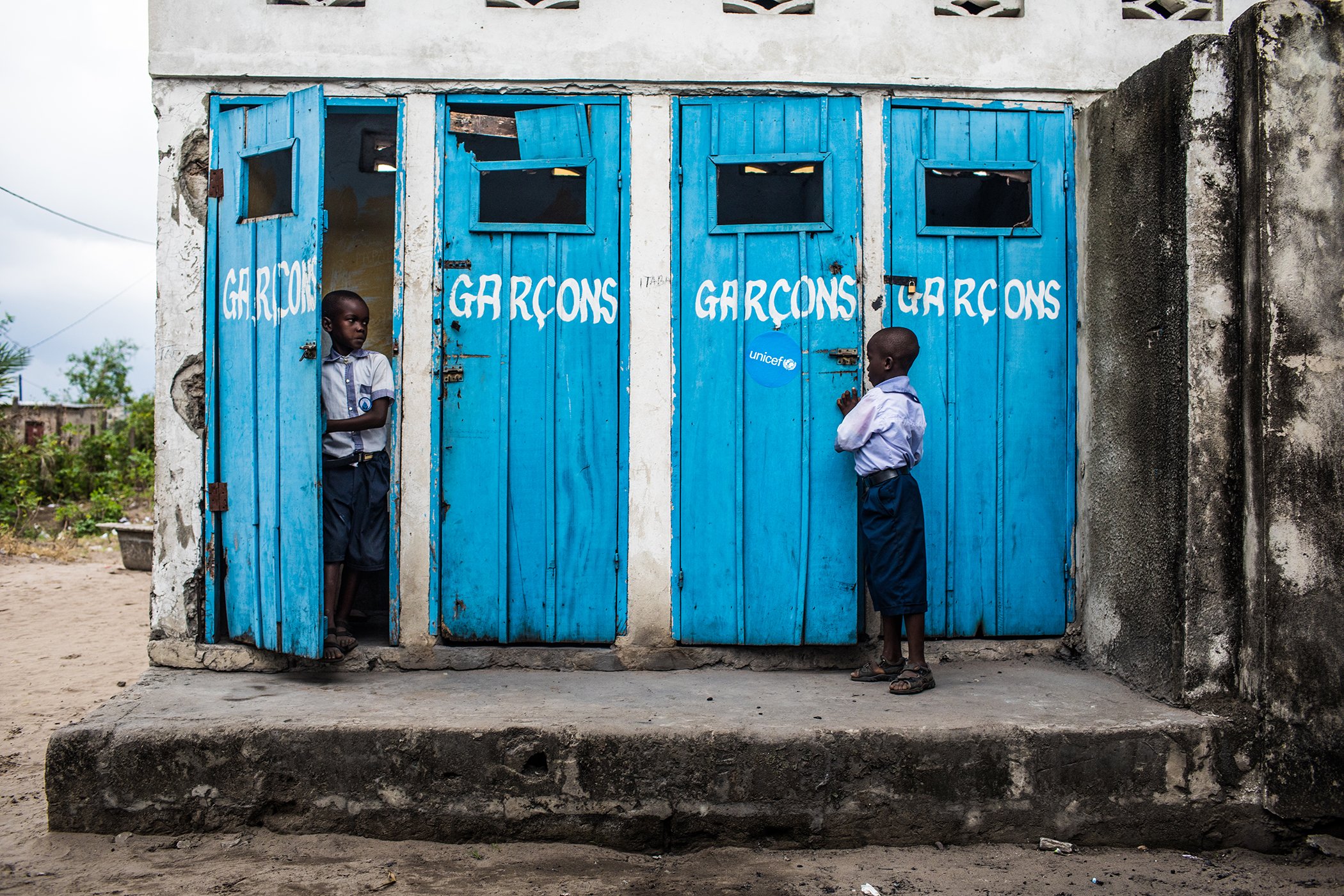 Students from the Marie Madeleine Primary School inspect the bathrooms to maintain clean latrines in Kinshasa, Democratic Republic of Congo. Here, children are taught the basics of proper hygiene and sanitation as a part of their education.