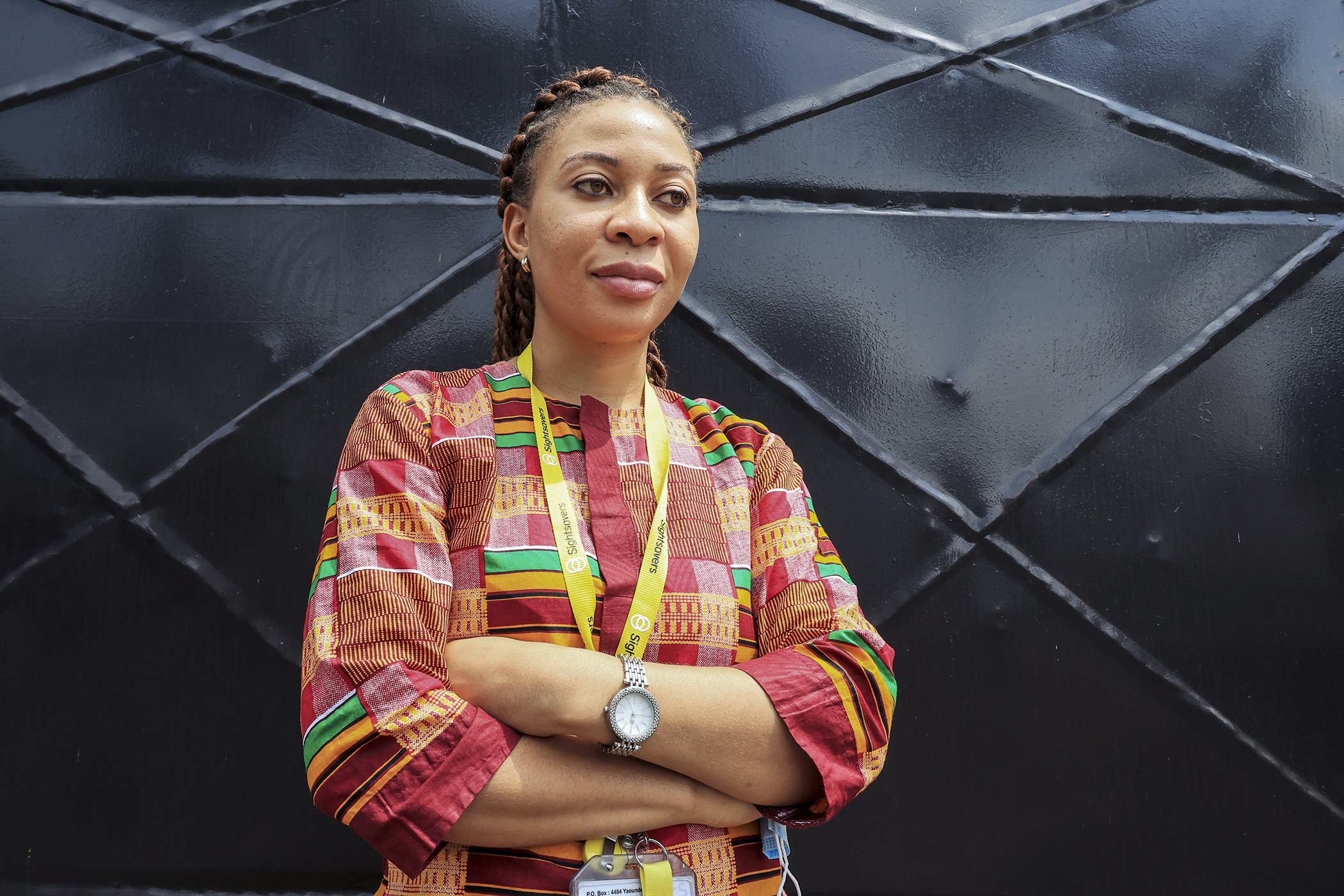 Kareen Atekem, research coordinator at Sightsavers, stands outside the Sightsavers offices in Yaoundé, Cameroon in November 2020.