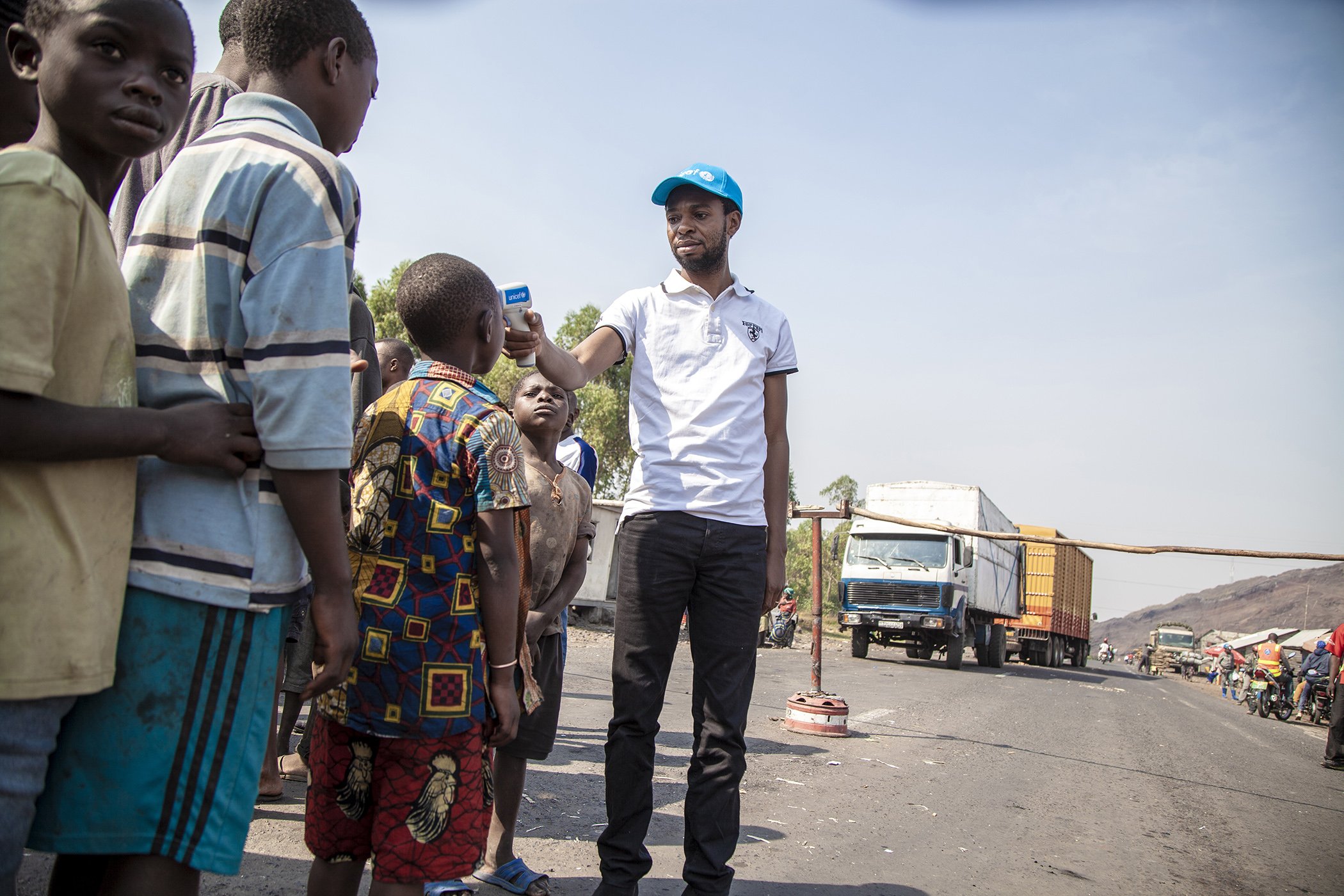 Children have their temperature taken to help contain the spread of Ebola at the entrance to Goma, North Kivu, the Democratic Republic of the Congo, on Aug. 10, 2018.