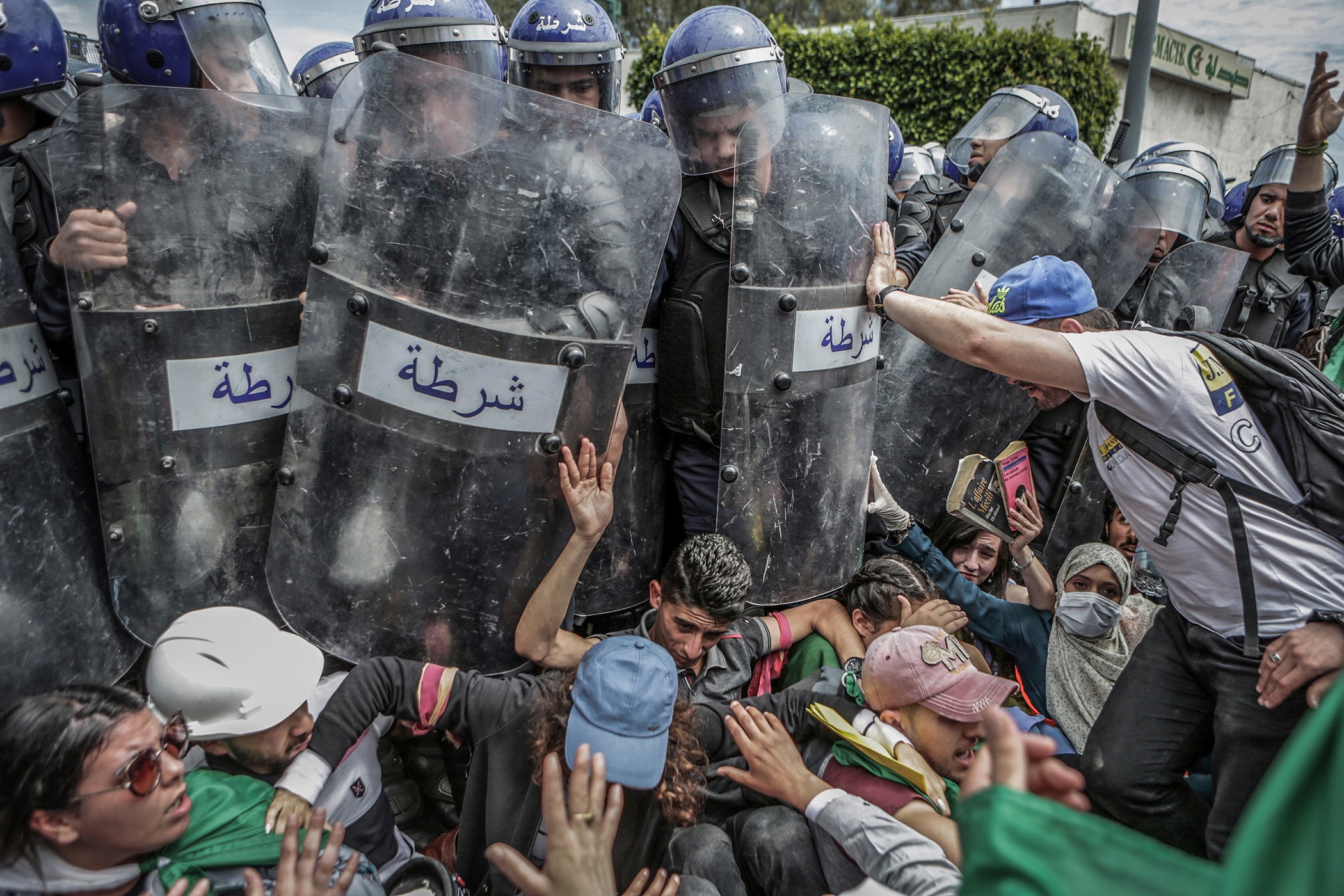Students scuffle with riot police during an anti-government demonstration in Algiers, Algeria, on May 21, 2019. Algeria has been embroiled in protests since last year, with protests initally aimed at ousting long-time president, Abdelaziz Bouteflika.