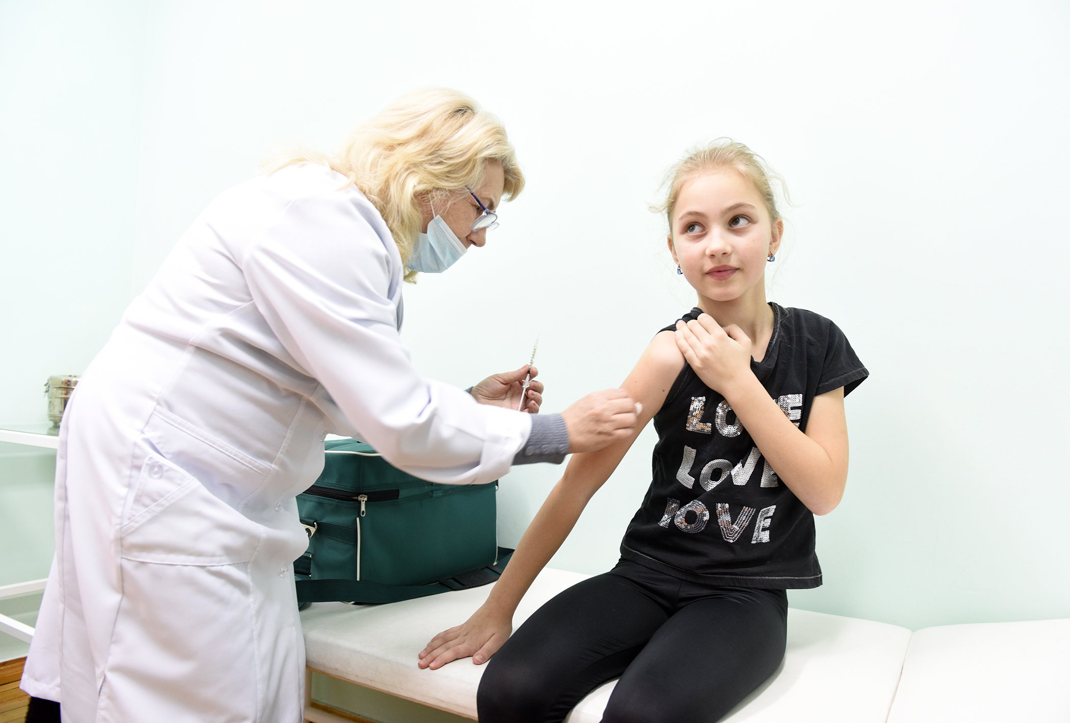Maryana Dzuba, 9, receives her first dose of the MMR vaccine on Feb. 21, 2019, at Lapaivka village school, Lviv region, Ukraine, as part of a three-week long vaccination campaign to increase MMR coverage among school-aged children in the region.