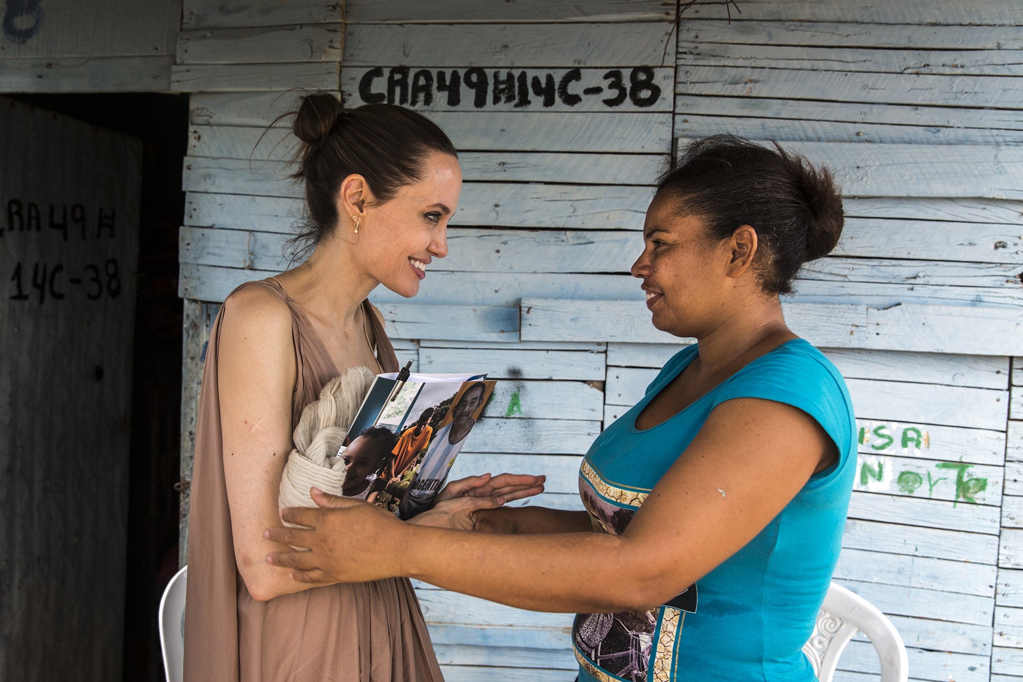 UNHCR Special Envoy Angelina Jolie speaks with Yoryanis Ojeda, 35, a former Colombian refugee who returned from Venezuela when she could no longer get food and medicine for her children.