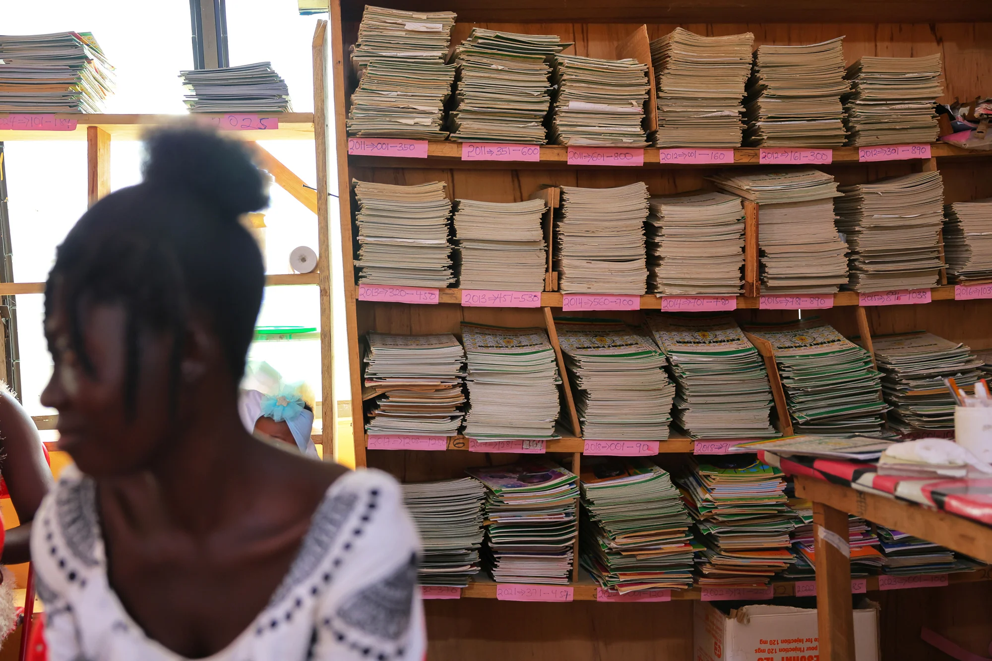 Patient health folders on a shelf at the Kotokuom CHPS Compound, Ayemansa District, Eastern Region, Ghana, on July 16, 2025. For too long, paper-based records — handwritten, fragile, easily lost — have created a system where access is uncertain.