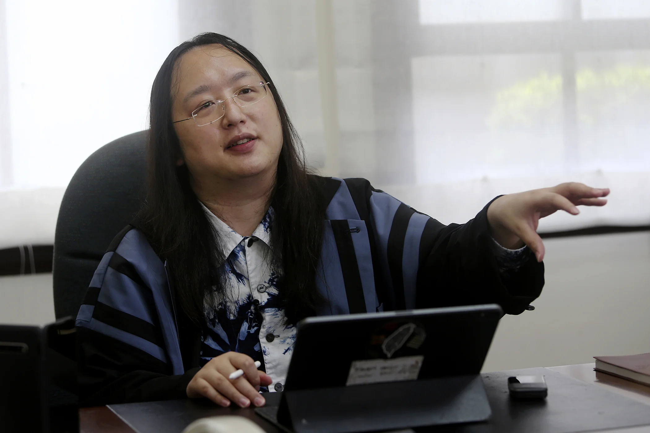 Taiwan's Digital Minister Audrey Tang speaks during an interview with The Associated Press in Taipei, Taiwan, Dec. 10, 2020.