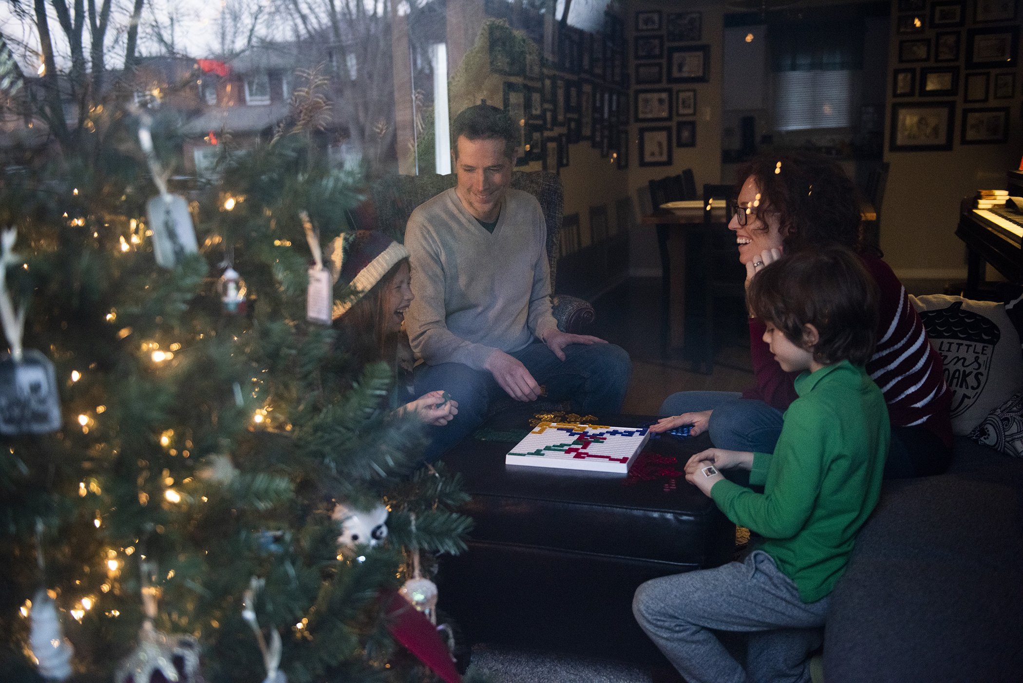 Jill Promoli and husband Craig McGee are pictured with their children Thomas and Isla in their home in Mississauga, Canada on Dec. 11, 2020.