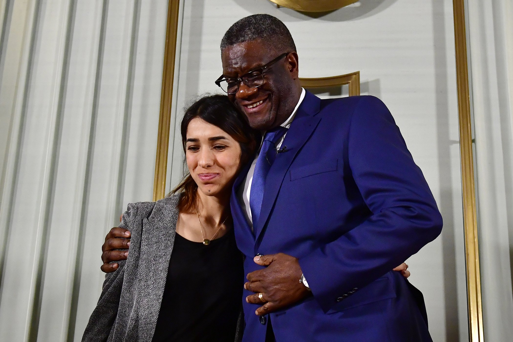 Nobel Peace Prize laureates Congolese doctor Denis Mukwege and Yazidi activist Nadia Murad hug at the end of a press conference on Dec. 9, 2018 in Oslo on the eve of the Peace Prize ceremony.
