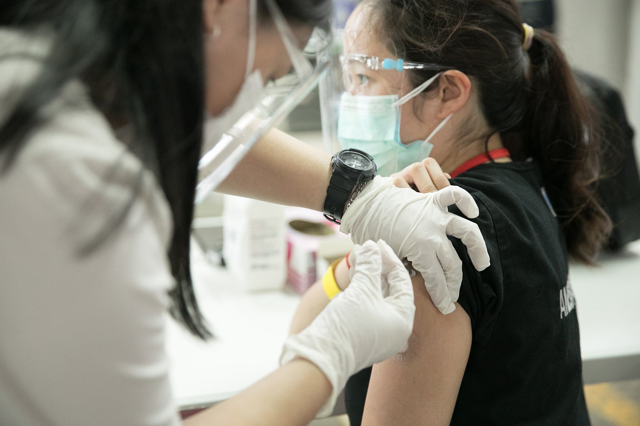 Health workers receive the COVID-19 vaccine in San Juan City, Metro Manila on March 6, 2021. UNICEF is leading the procurement and delivery of these vaccines through the COVAX Facility, a partnership with  The WHO, Gavi, the Vaccine Alliance, and CEPI.