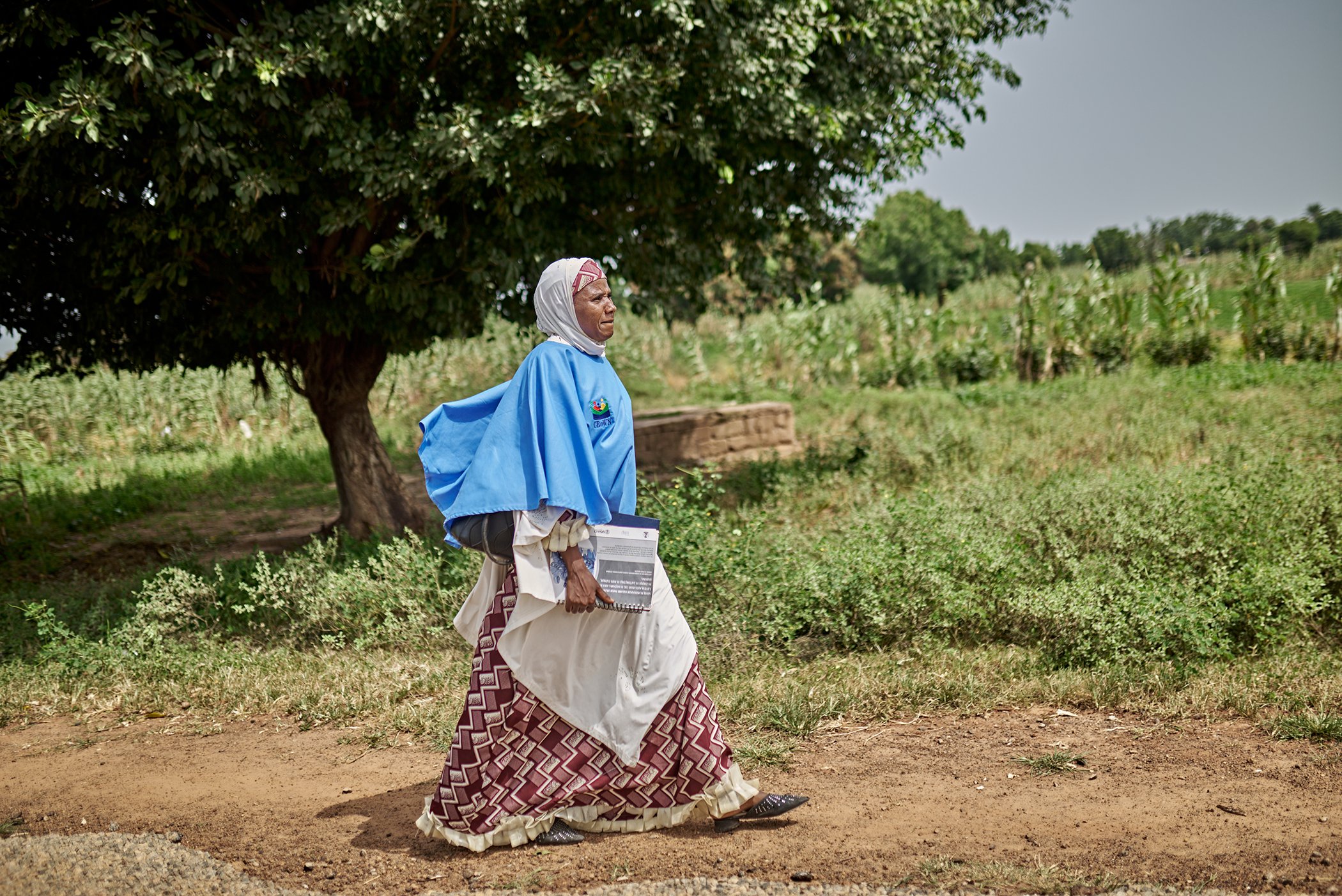 Furera Aliyu, 39, walks back after a day of work in Nigeria's Bauchi State. Aliyu is a frontline worker and polio team  supervisor with the Community Re-Orientation Women Network (CROWN).