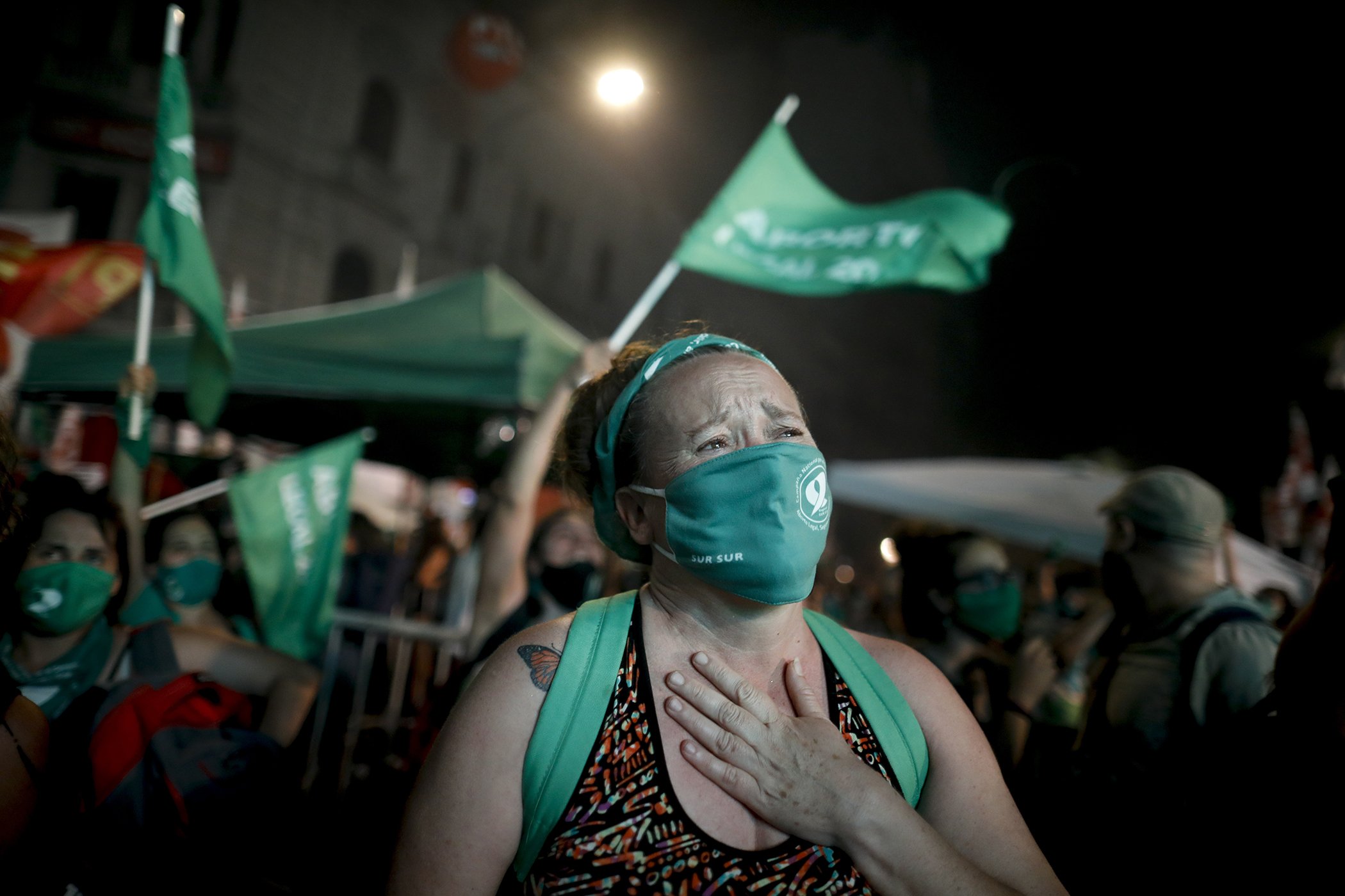 A womens reproductive rights activist reacts after lawmakers approved a bill that legalizes abortion, outside Congress in Buenos Aires, Argentina, Dec. 30, 2020.