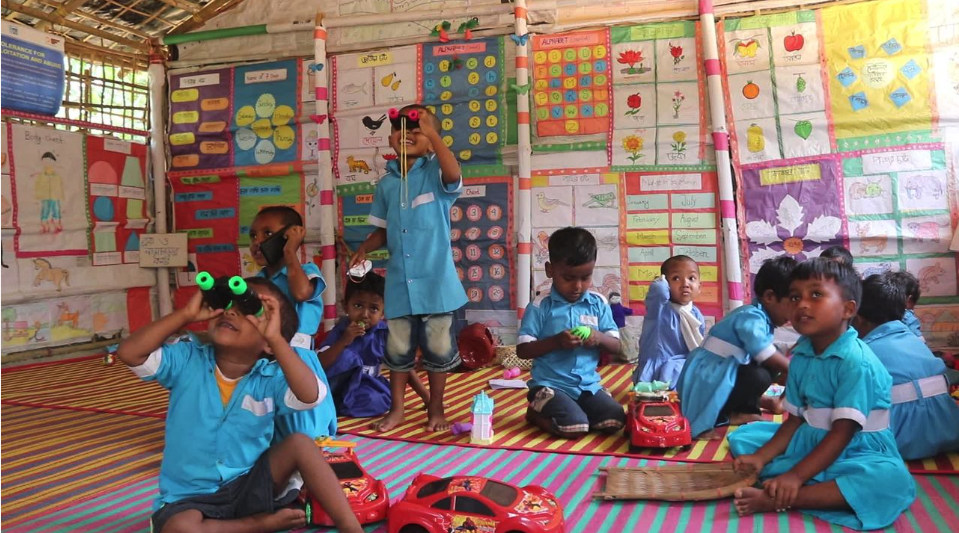 Rohingya refugee children play at the Shishu Bikash Kendra early childhood center in Cox's Bazar, Bangladesh, which employs the “learning through play” education approach implemented UN organization, Education Cannot Wait.
