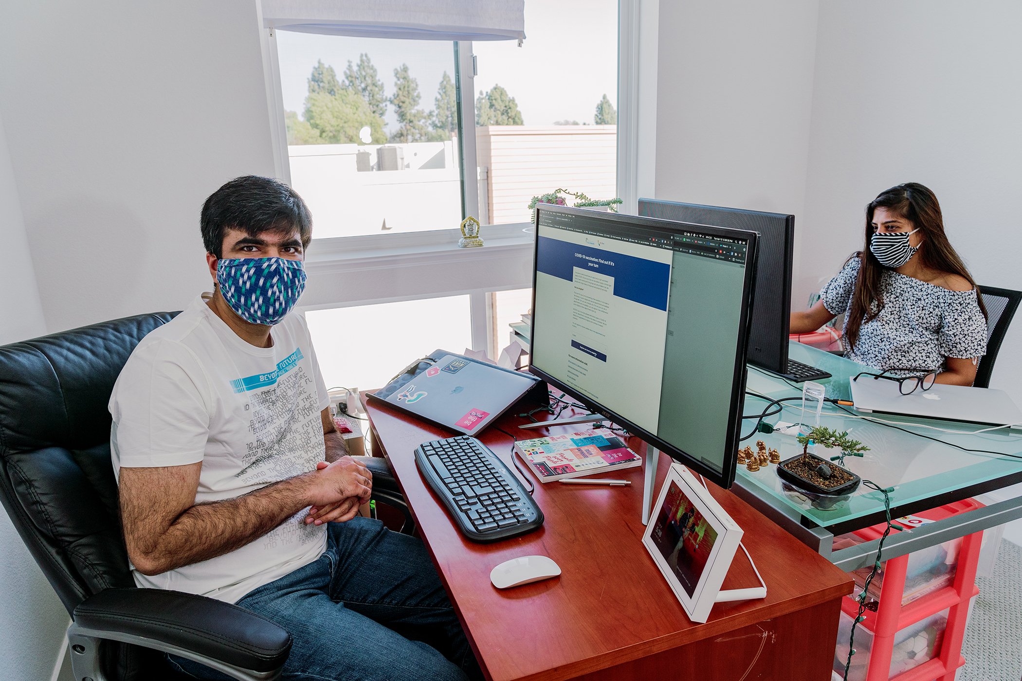 Abhishek Daryani displays the California’s vaccine website, myturn.ca.gov, in their home office where he works with his wife, Pooja Daryani, on their Bay Area vaccine hunters group.