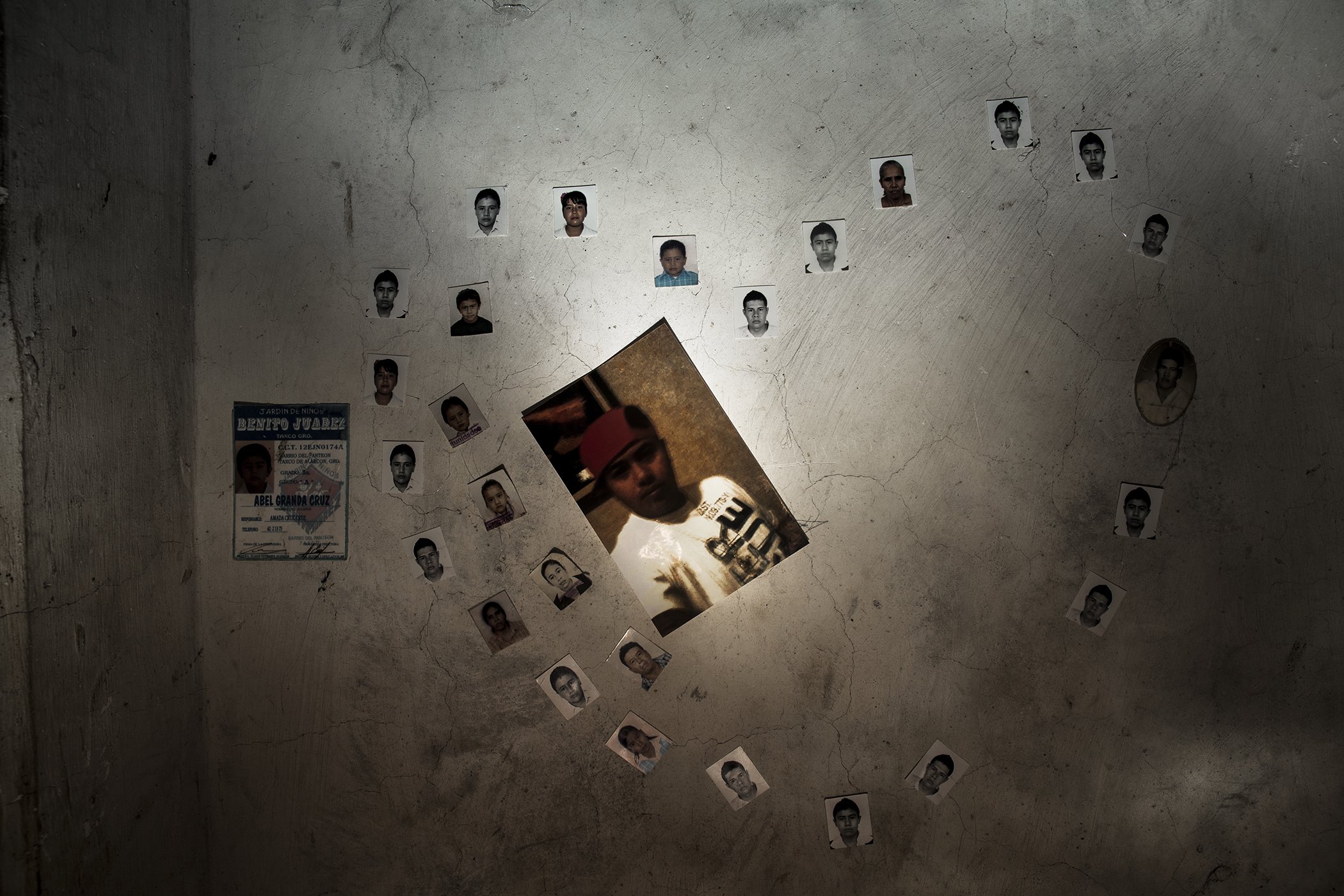 Family heart. "Photos on the wall of Perla Granda's (my sister-in-law) bedroom of her missing brothers. She is 14 years old, she is in high school. She lives with her mother and Her sister Sandra at Taxco Guerrero Mexico." Taken on September 10, 2013.