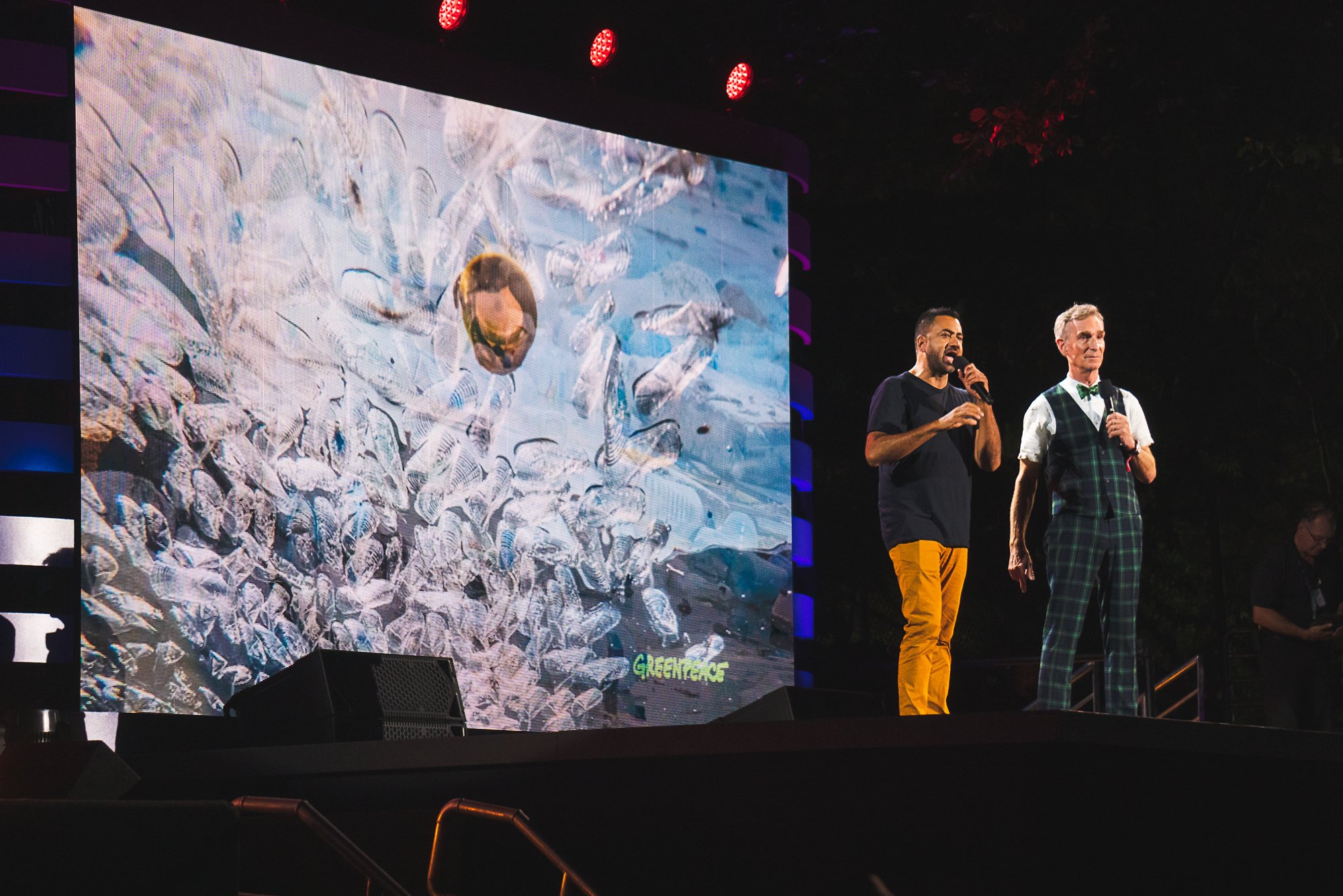 Kal Penn (L) and Bill Nye (R) speak on stage during the Global Citizen Festival on Sept. 28, 2019, in New York City.
