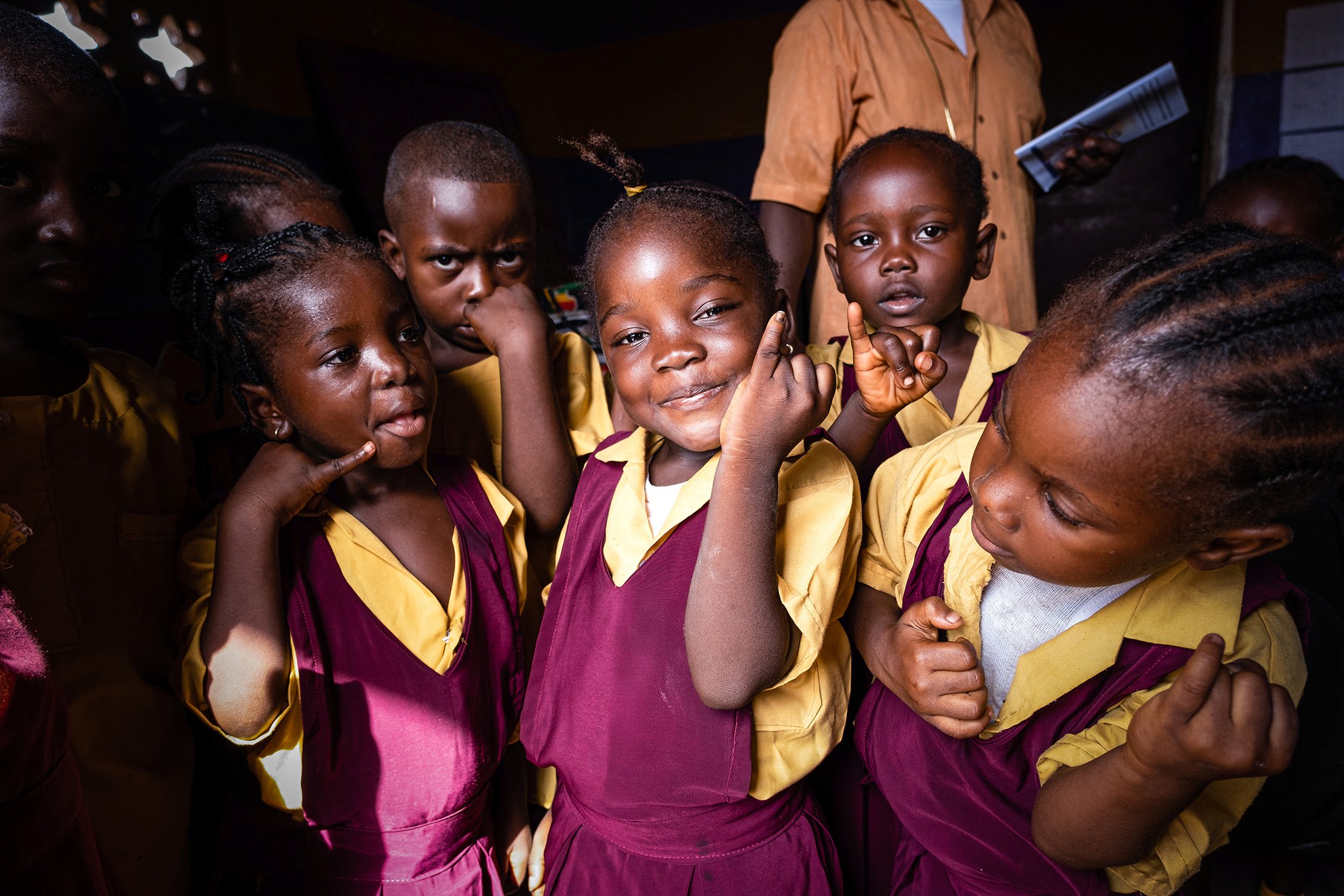 Kindergarten students from the Bishop Boegbah Institute in Monrovia, Liberia, proudly show their marked fingers after receiving the oral polio vaccine on March 29, 2021.