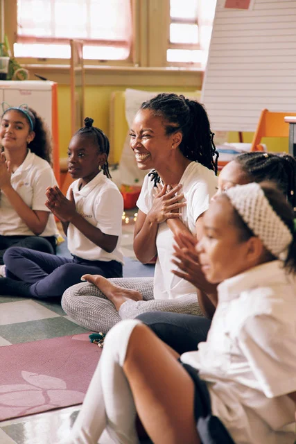 Dr.Chelsea Jackson Roberts with students from Girls Prep: Bronx Elementary School.