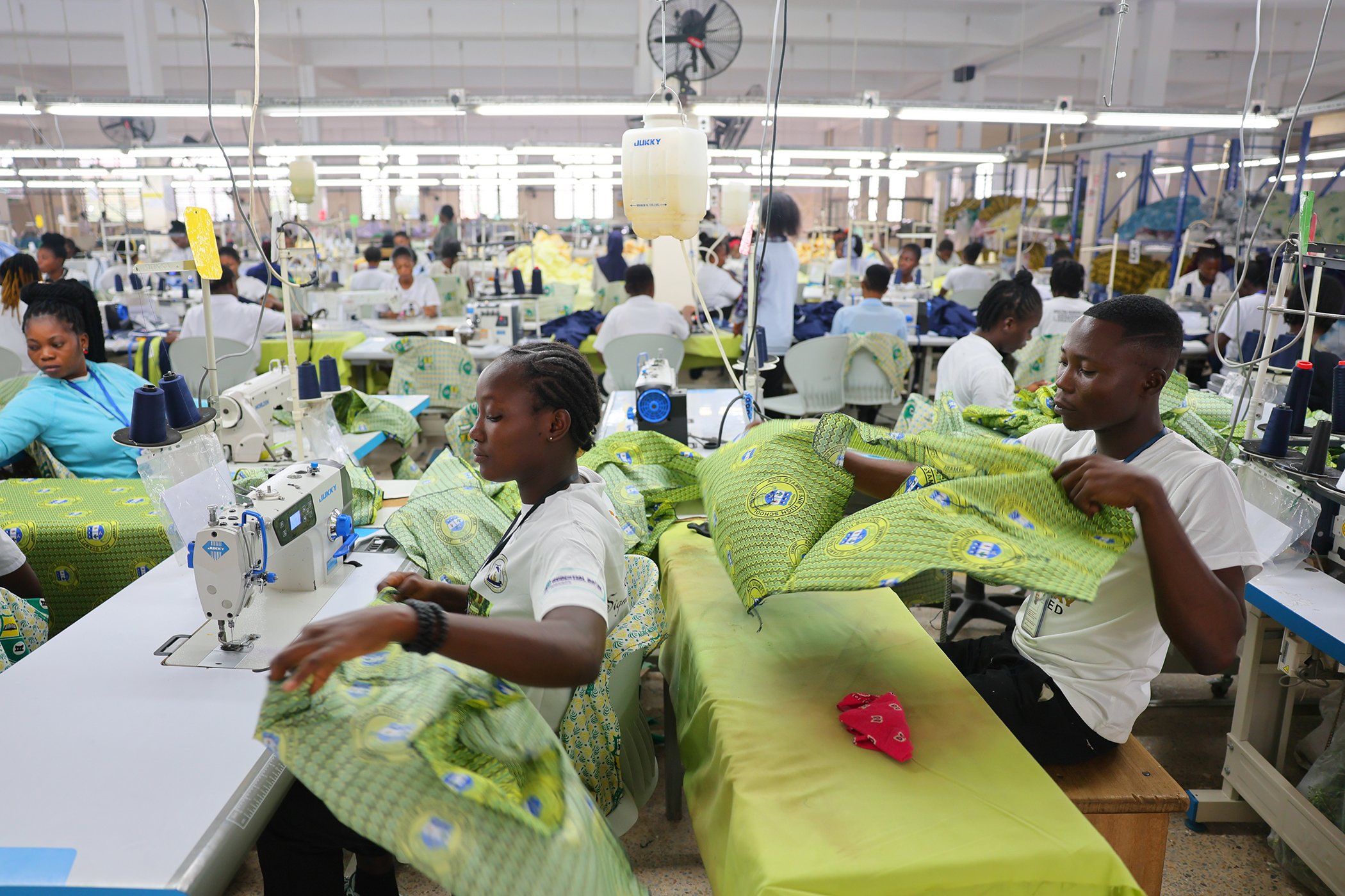 Workers cut, sew, and package garments on the UNI Jay production floor in Kumasi, Ghana, on August 4, 2025.