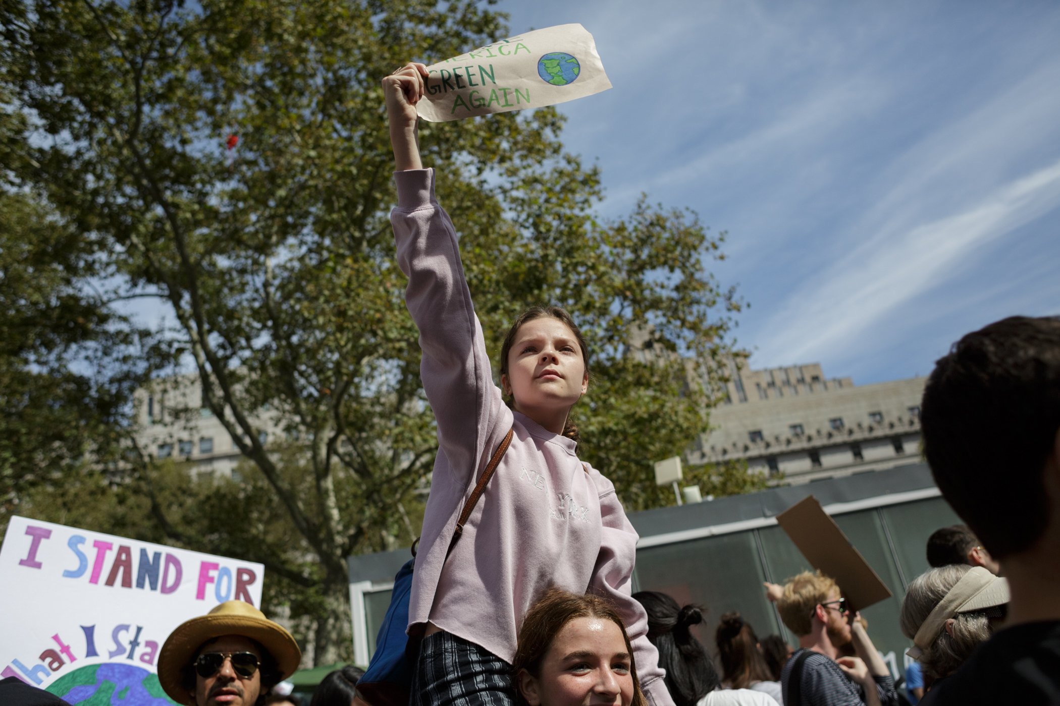 Protestors hold signs during the Global Climate Strike demonstration in New York, NY., on Sept. 20, 2019.