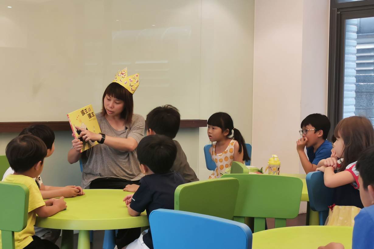 Lesbian mother Jovi Wu (L) tells stories during a storytelling session that she runs for children on promoting gender equality in Zhongli District, Taoyuan City, Taiwan, May 5, 2019.