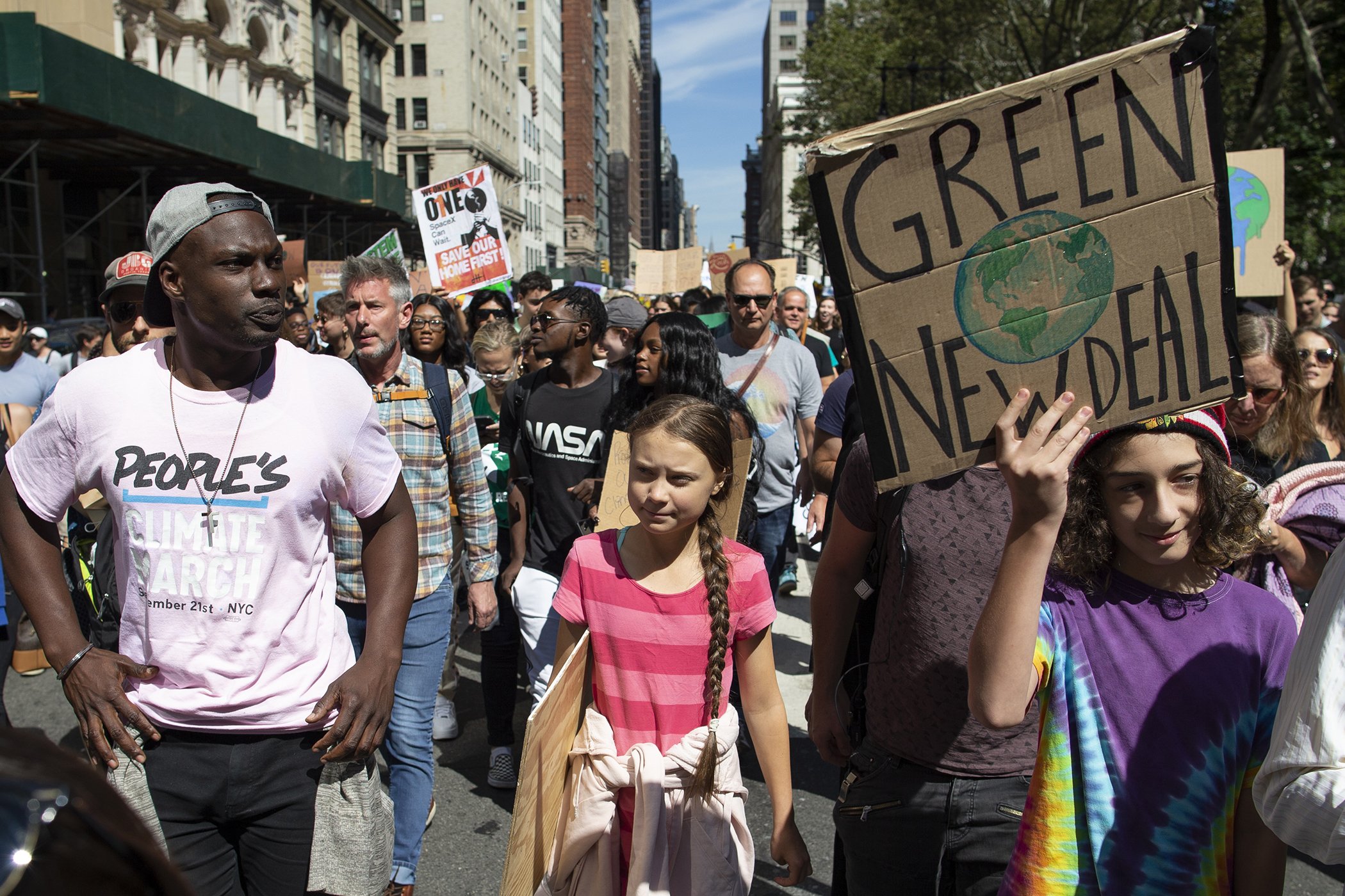 Swedish environmental activist Greta Thunberg, center, takes part during the Climate Strike, Sept. 20, 2019 in New York.
