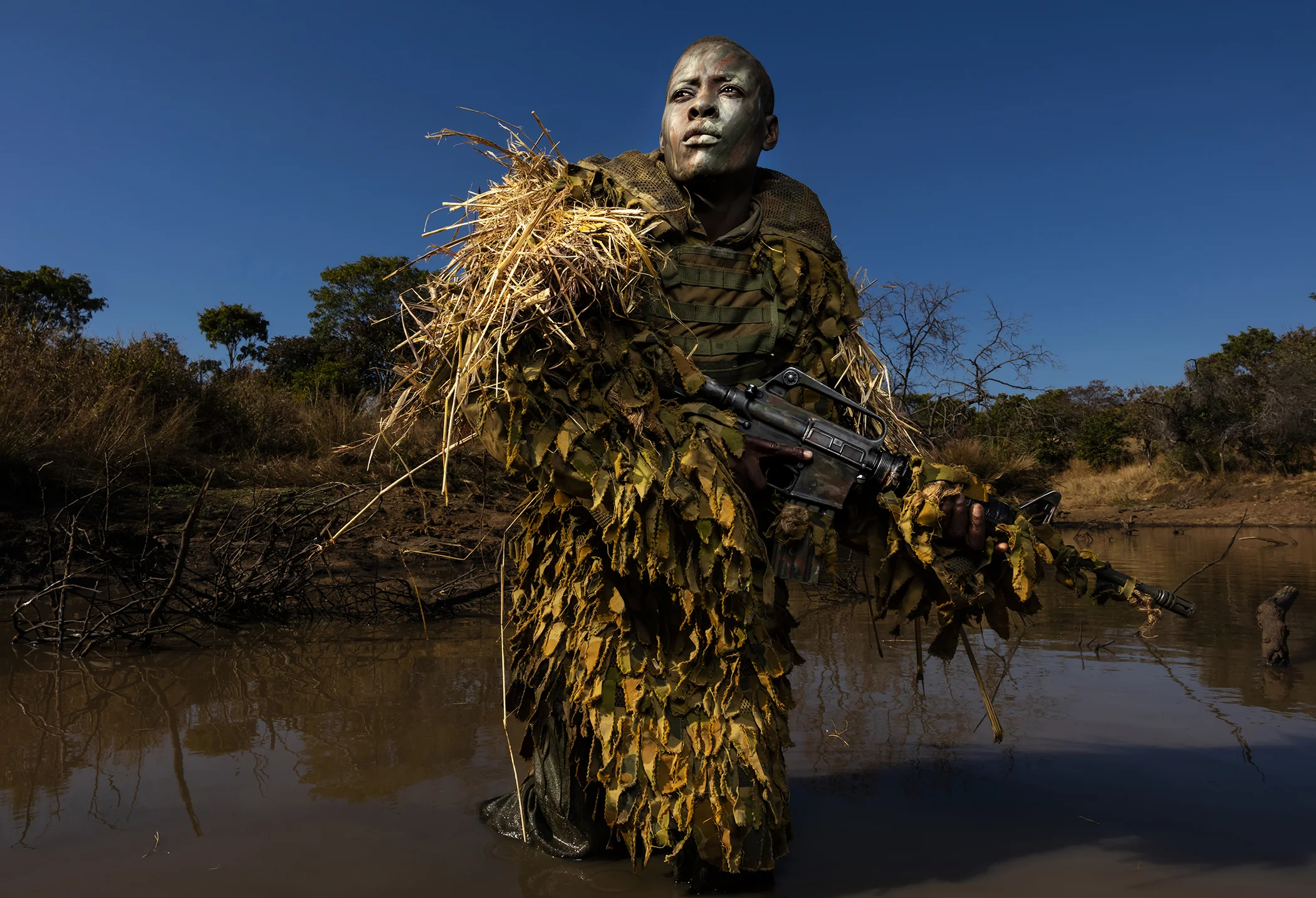 Petronella Chigumbura (30), a member of an all-female anti-poaching unit called Akashinga, participates in stealth and concealment training in the Phundundu Wildlife Park, Zimbabwe.
