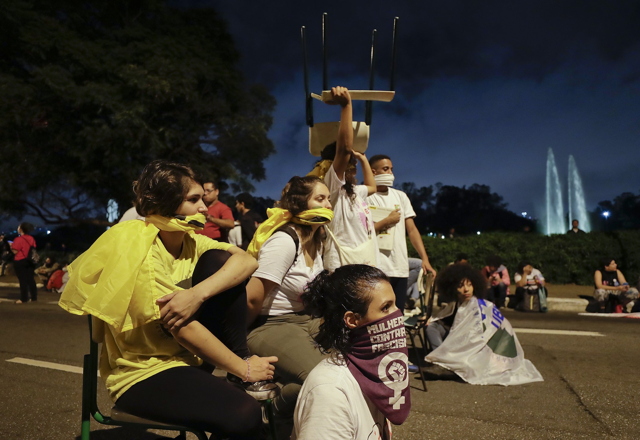 Students block a street, sitting in school chairs as they protest against a massive cut in the education budget imposed by the administration of Brazilian President Jair Bolsonaro, in Sao Paulo, Brazil, May 15, 2019.