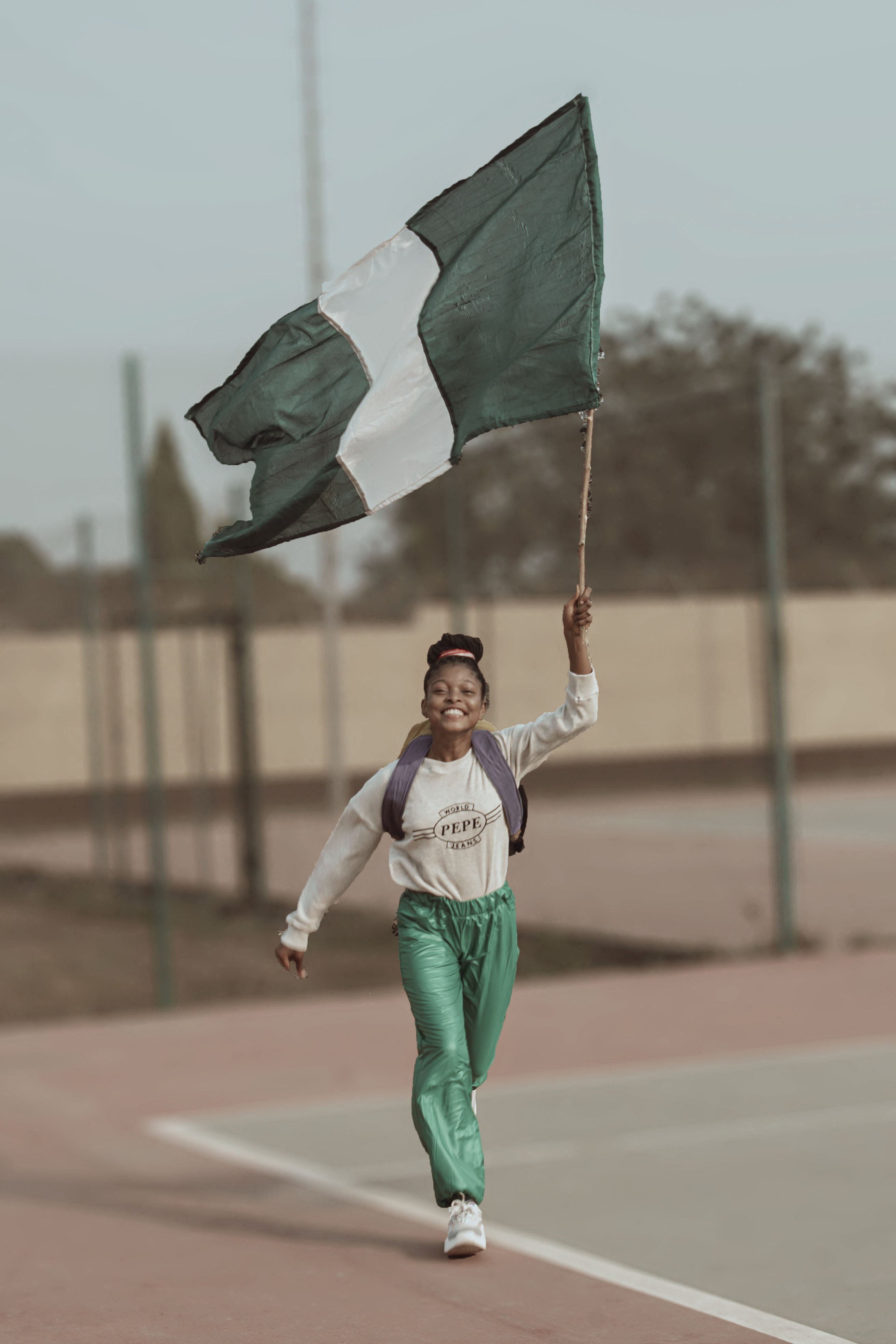 A Dreamcatchers Academy student in a recreation of a portrait of Chioma Ajunwa, a former Nigerian athlete, notable for becoming the first black African woman to win an Olympic gold medal in a field event. Photo: DocumentWomen/Dreamcatchers Academy.