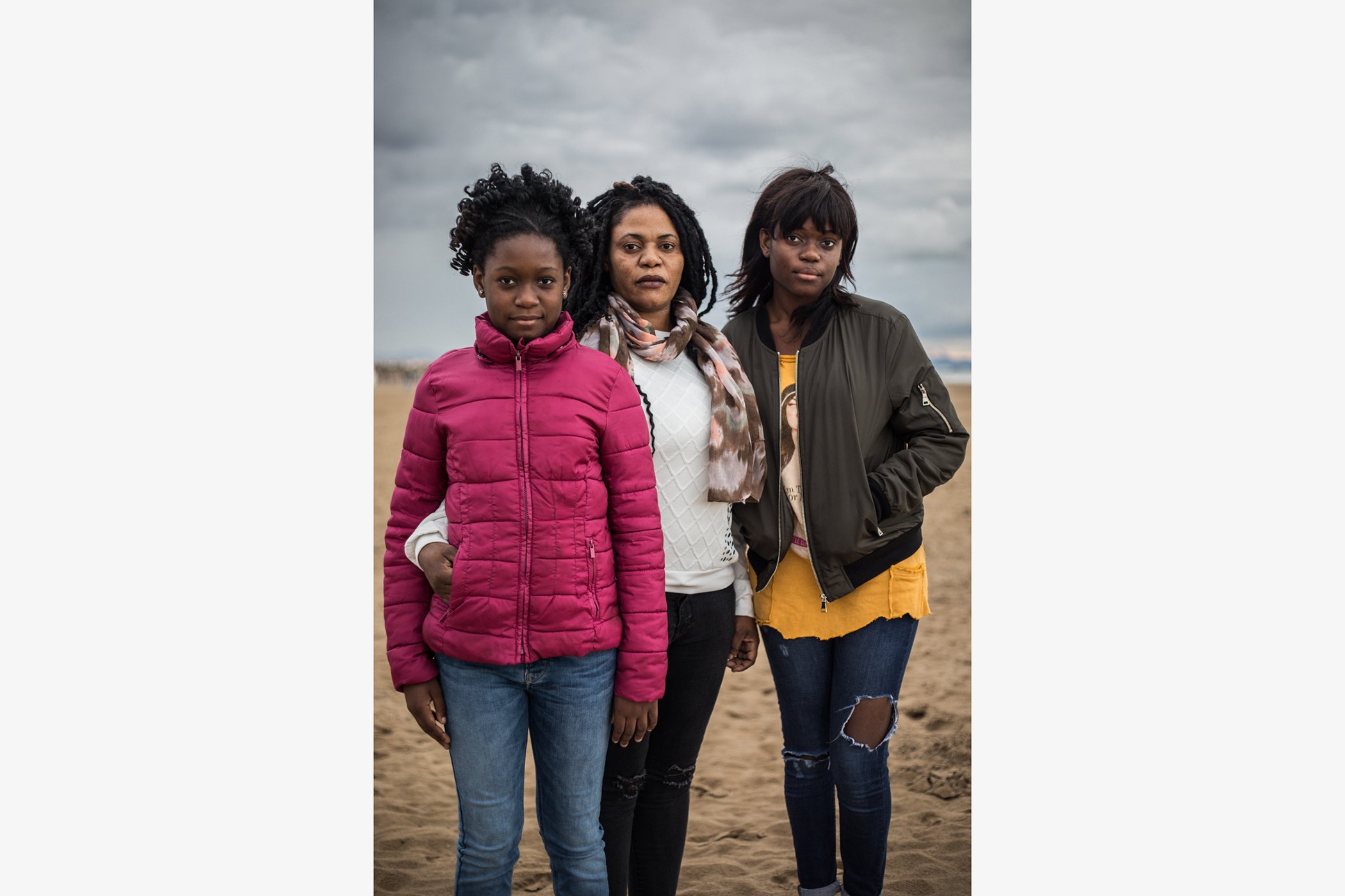Vivian Ntih, 43, is pictured with her daugthers Elizabeth, 9, and Mari Mensah Damson, 15. Vivian came from Nigeria to Spain in 2000 and lives now with her daugthers in Valencia.