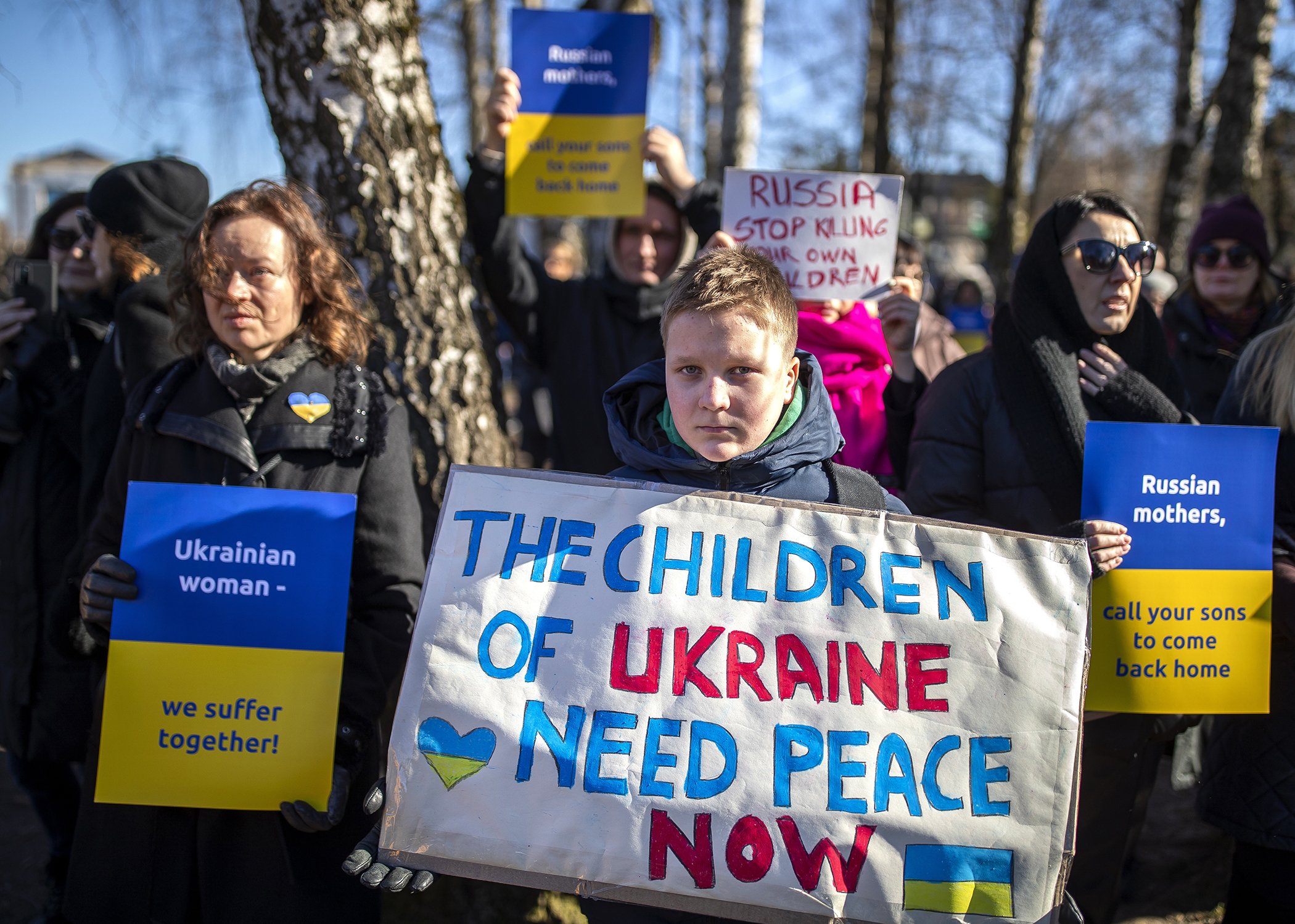 People take part in a protest against the Russian invasion of Ukraine in front of the Russian embassy in Vilnius, Lithuania, Feb. 27, 2022.