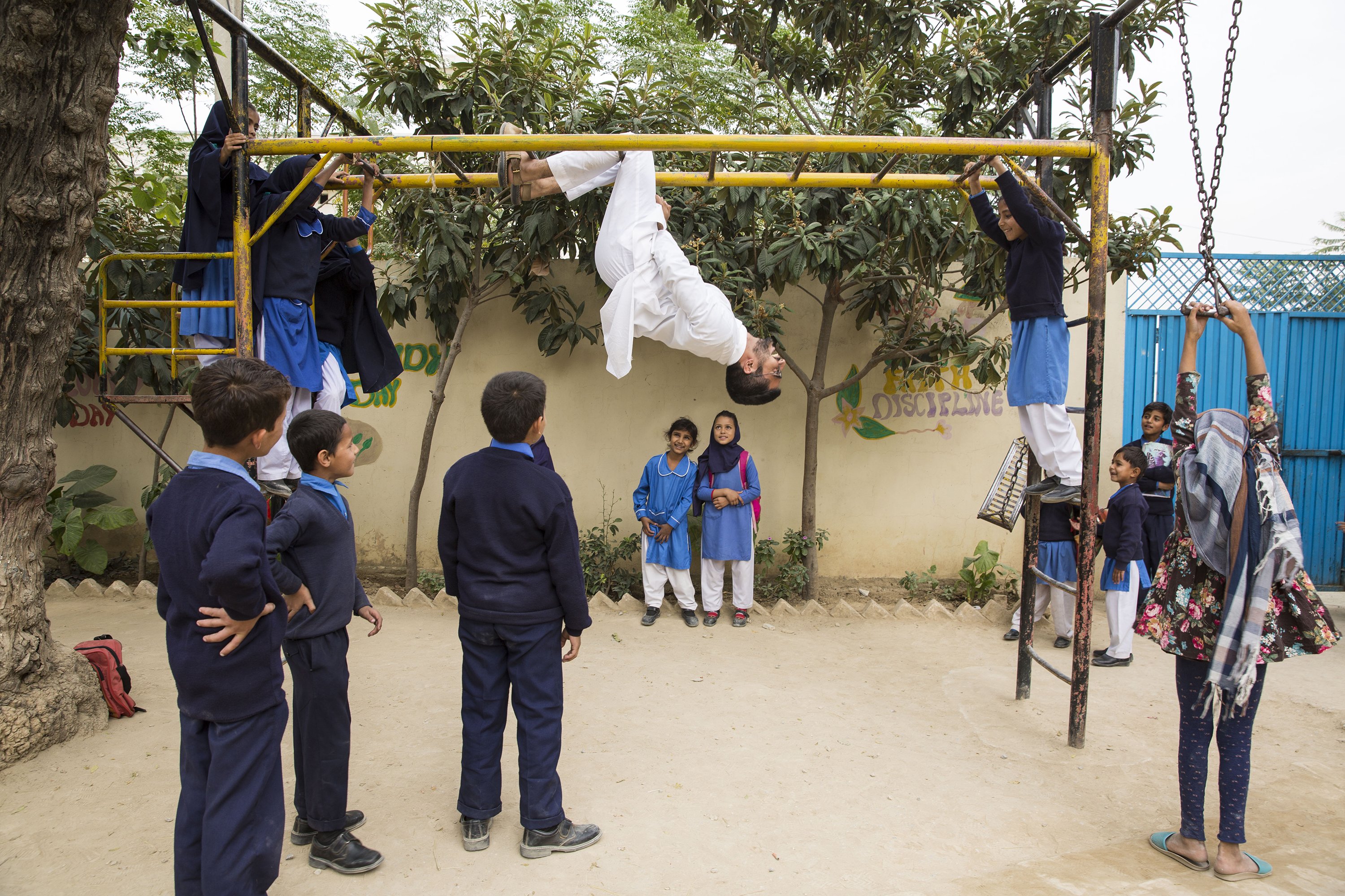 Haroon Yasin plays with students at the Saya School in Islamabad, Pakistan on Nov. 14, 2019.