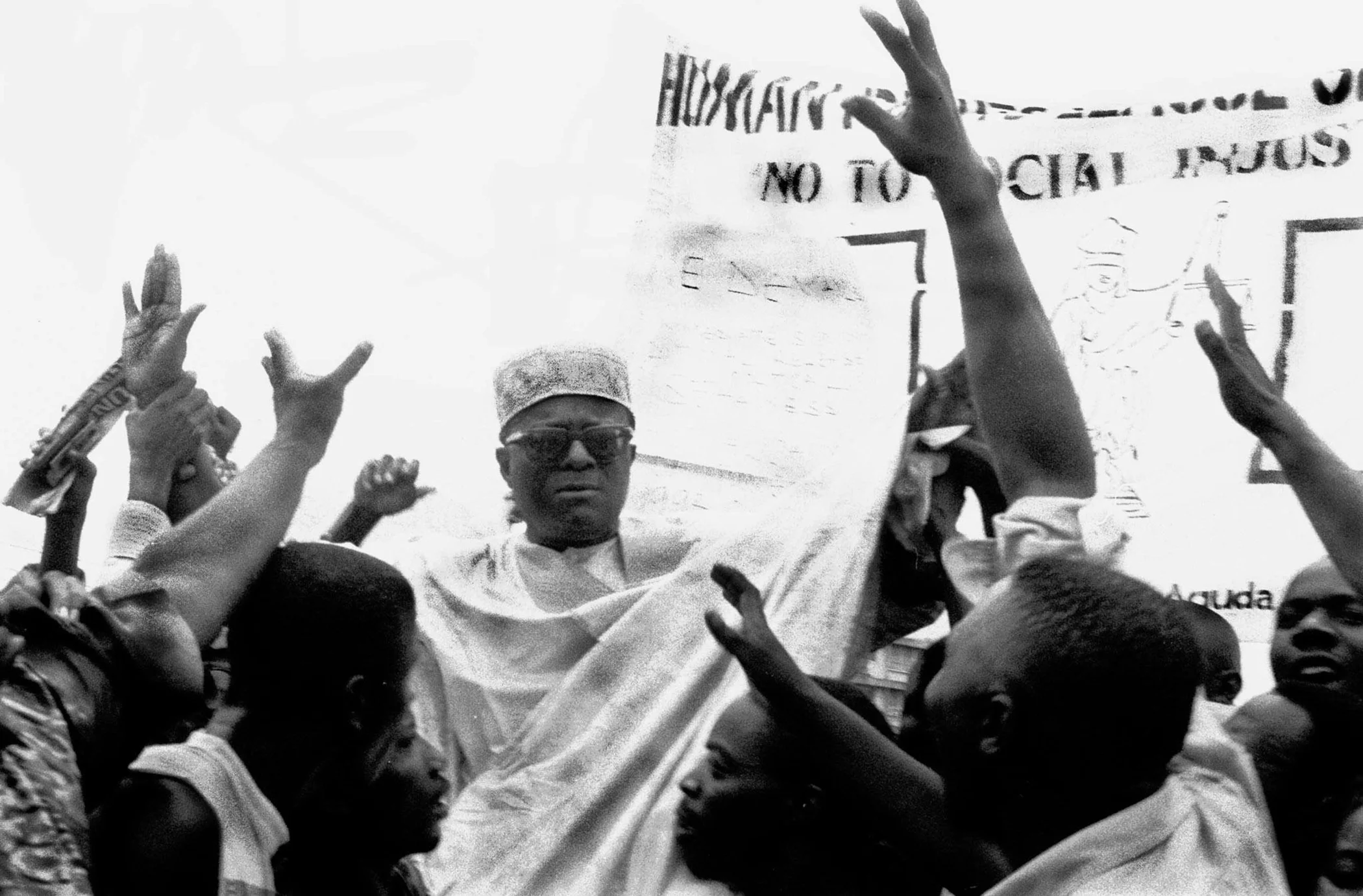 Gani Fawehinmi, a Lagos attorney and opposition leader, is welcomed by demonstrators during a pro-democracy rally on Friday, June 12, 1998, in Lagos, Nigeria.
