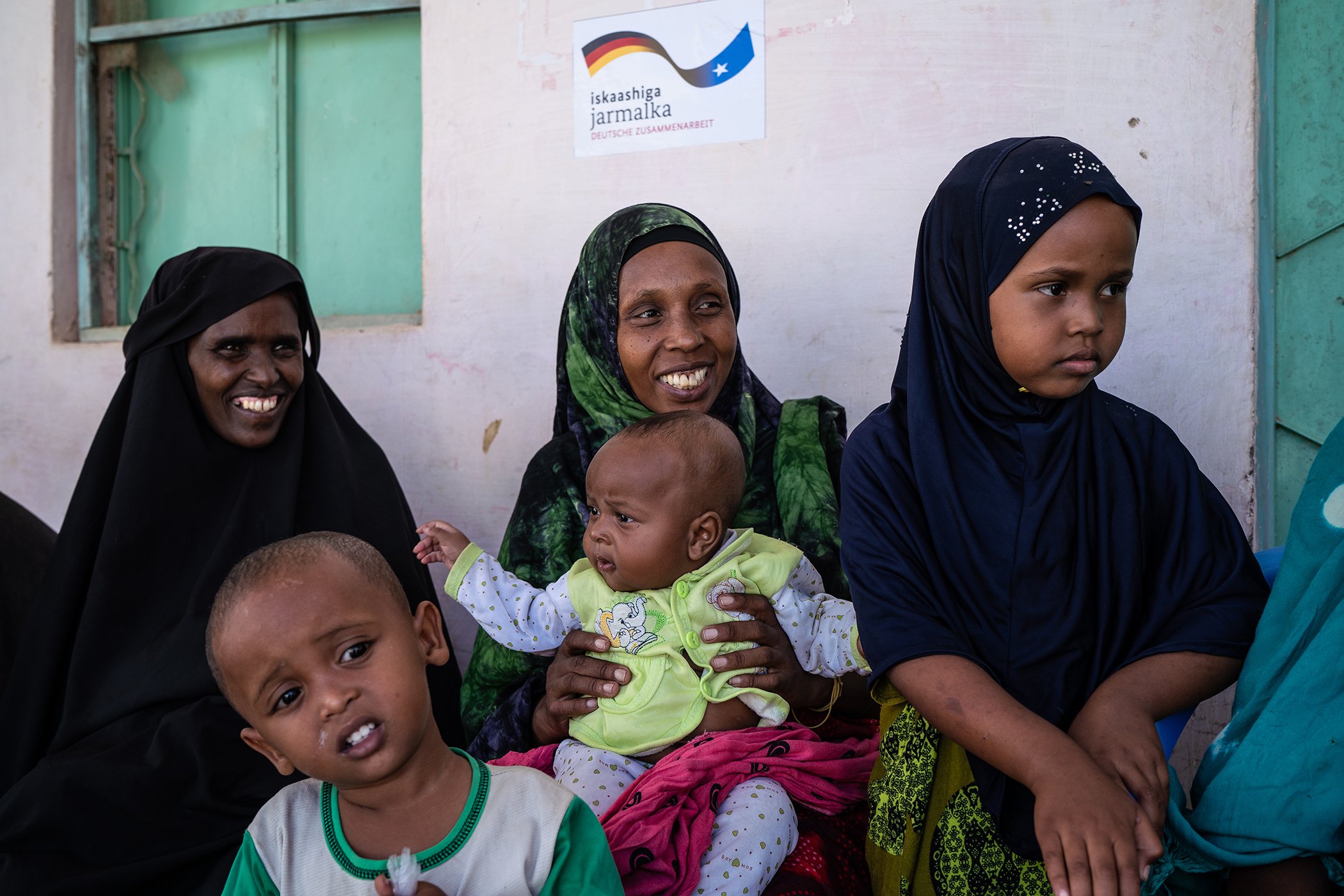 Women and children at outside a UNICEF-supported health clinic funded by the government of Germany (BMZ) through KfW Development Bank in Garowe, Somalia, Monday, Dec. 10, 2018.