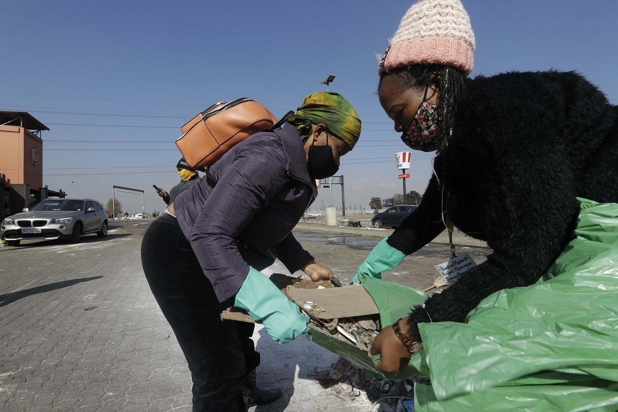 Clean up operations get underway at a shopping centre in Vosloorus, near Johannesburg, July 15, 2021.
