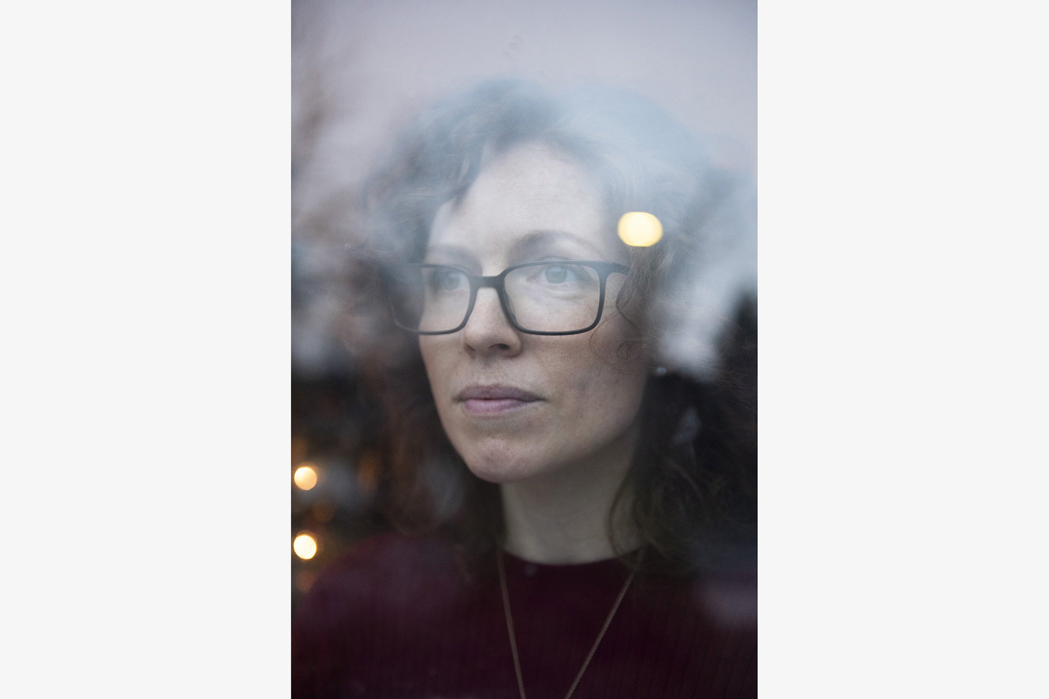 Jill Promoli poses for a photo by the window in her home in Mississauga, Canada on Dec. 11, 2020.