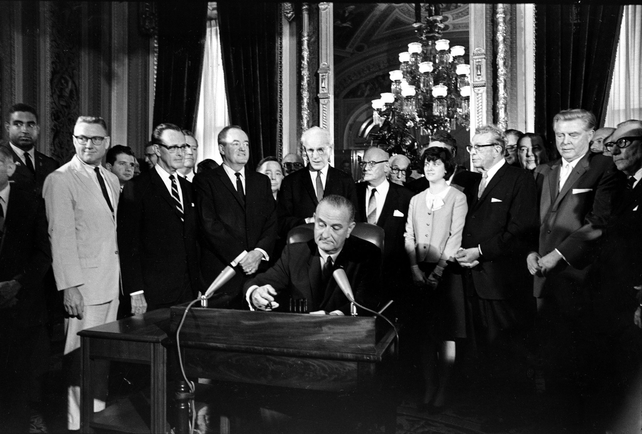 U.S. President Lyndon B. Johnson signs the Voting Rights Act of 1965 in a ceremony in the President's Room near the Senate chambers in Washington, D.C., Aug. 6, 1965.