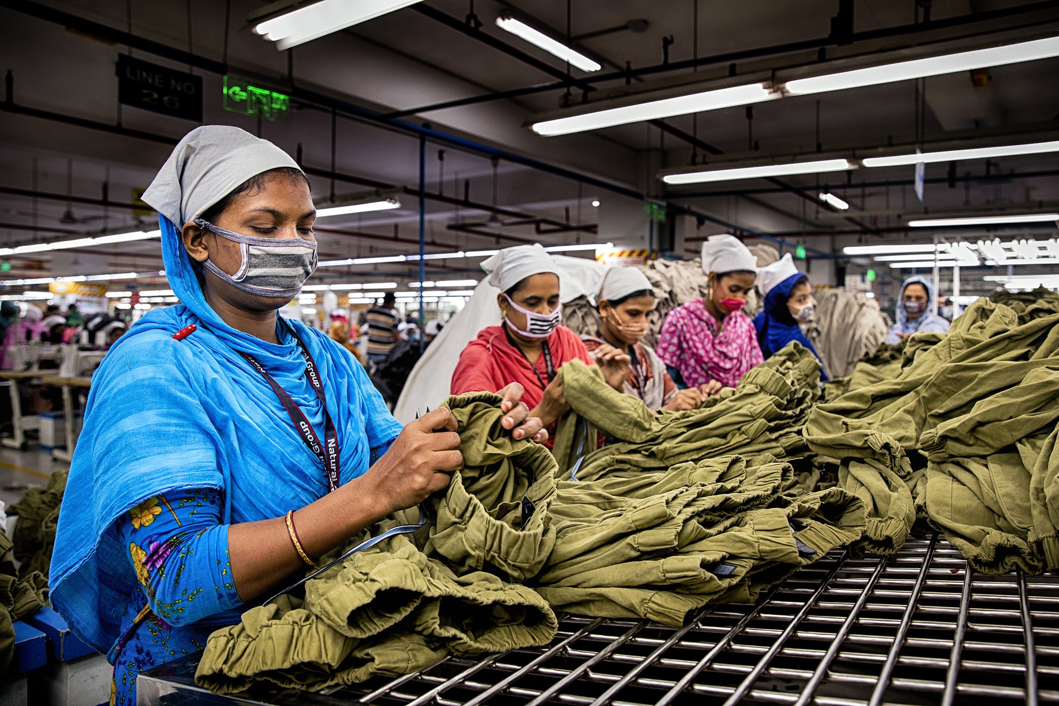 Textile workers are photographed inside a factory in Dhaka, Bangladesh in October 2022.