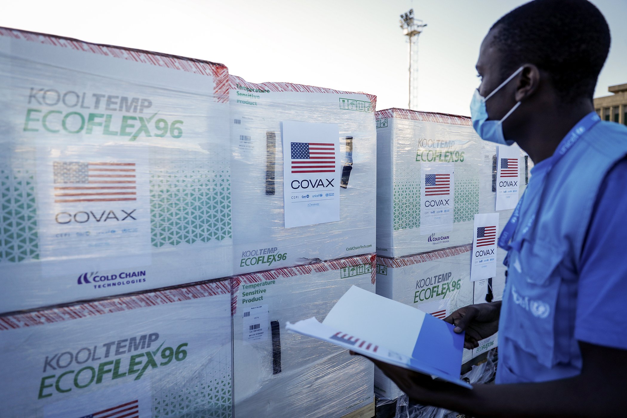A UNICEF worker checks boxes of the Moderna vaccine after their arrival at the airport in Nairobi, Kenya on Aug. 23, 2021.
