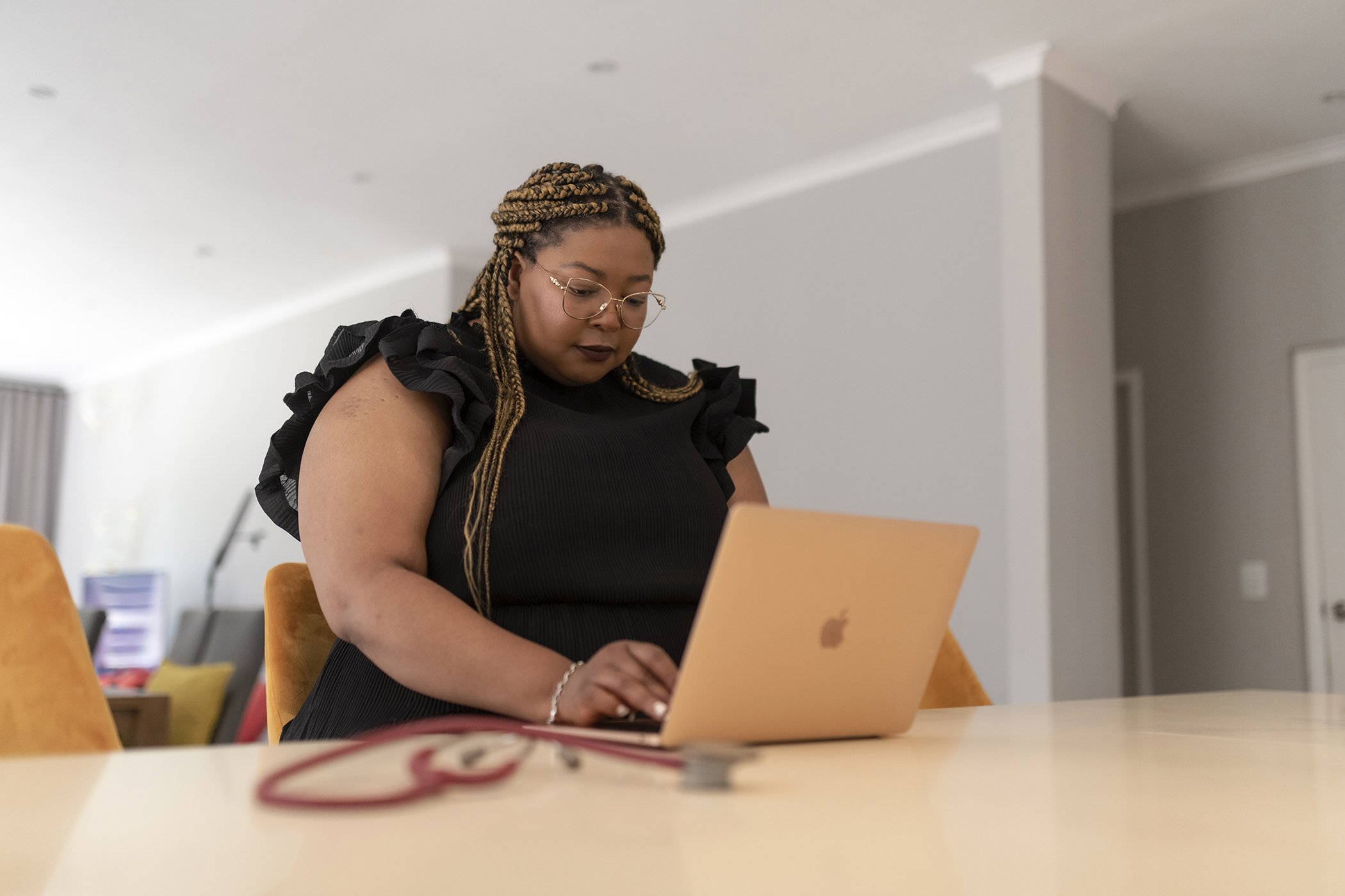 Dr Tlaleng Mofokeng works on her laptop at her home in Johannesburg in August 2022.