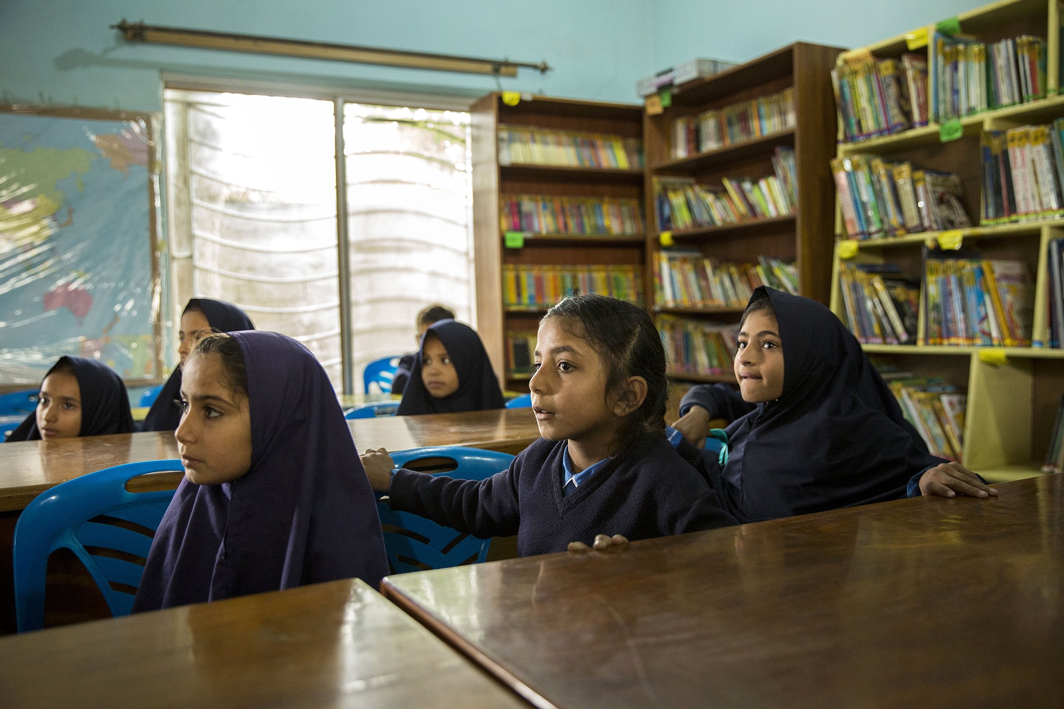 Children watch videos on the Taleembabad app at the Saya School in Islamabad, Pakistan on Nov. 14, 2019.
