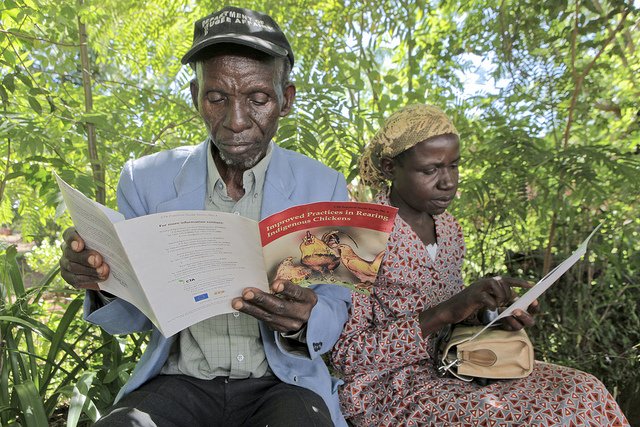 A couple learns about sustainable farming practices.