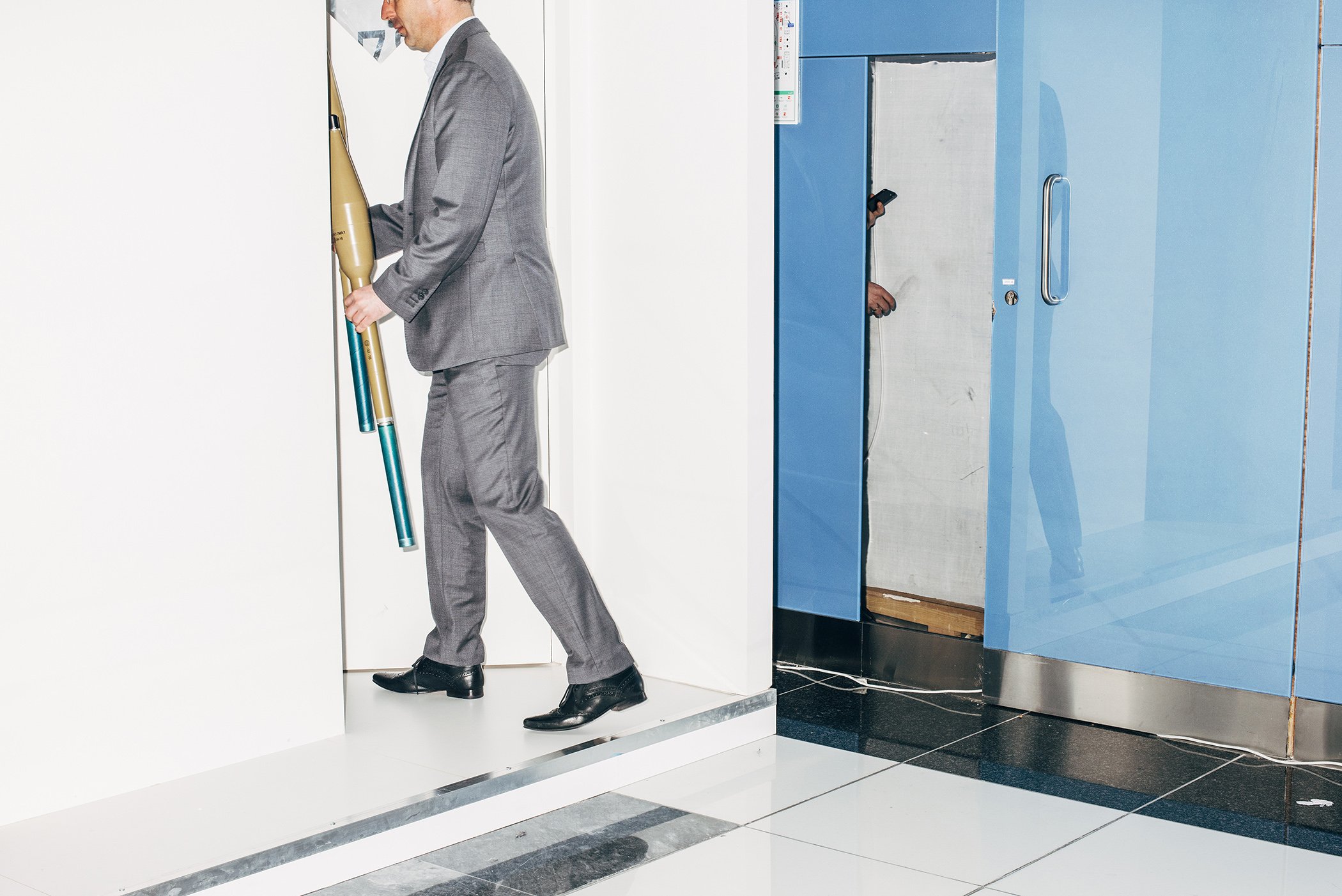 A man locks away a pair of anti-tank grenade launchers at the end of the day, at the International Defense Exhibition and Conference (IDEX) in Abu Dhabi, UAE, on Feb. 18, 2019. IDEX is the biggest defense exhibition and conference in the Middle East.