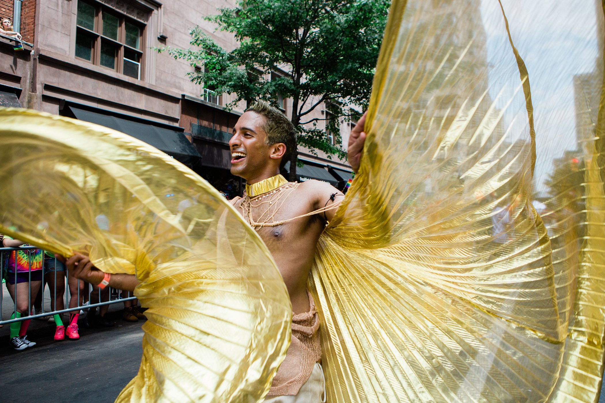 A participant dancing in the 2018 NYC Pride March.