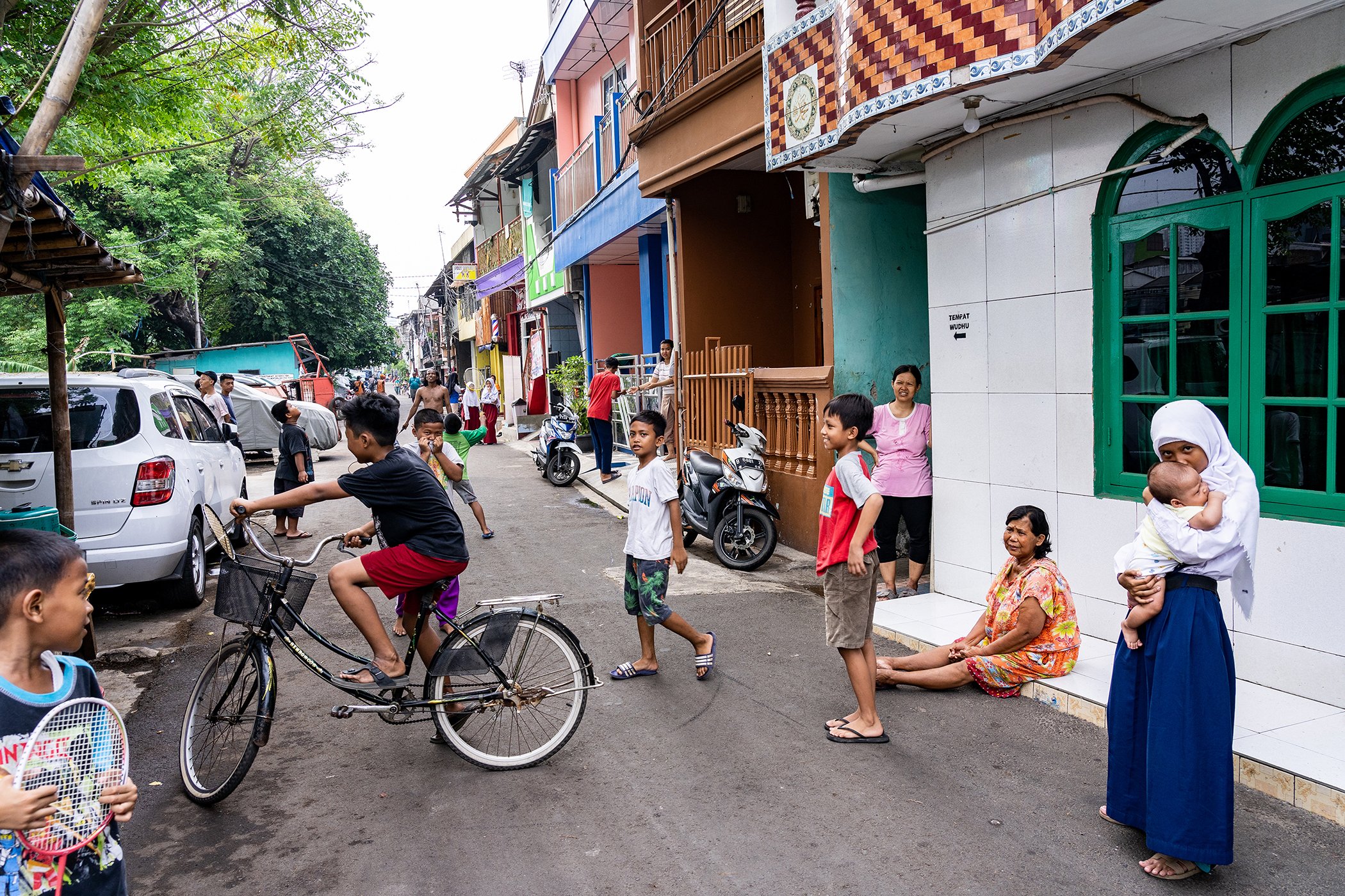 Residents are seen in the streets of the Kelurahan Menteng neighborhood in Jakarta, an area prone to flooding.