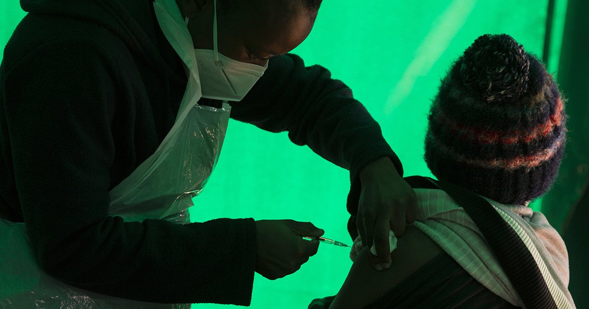 In this June 3, 2021, file photo an elderly patient receives a dose of the Pfizer COVID-19 vaccine, at a clinic at Orange Farm, near Johannesburg. Pfizer has announced that a South African firm will begin producing the Pfizer-BioNTech COVID vaccine.